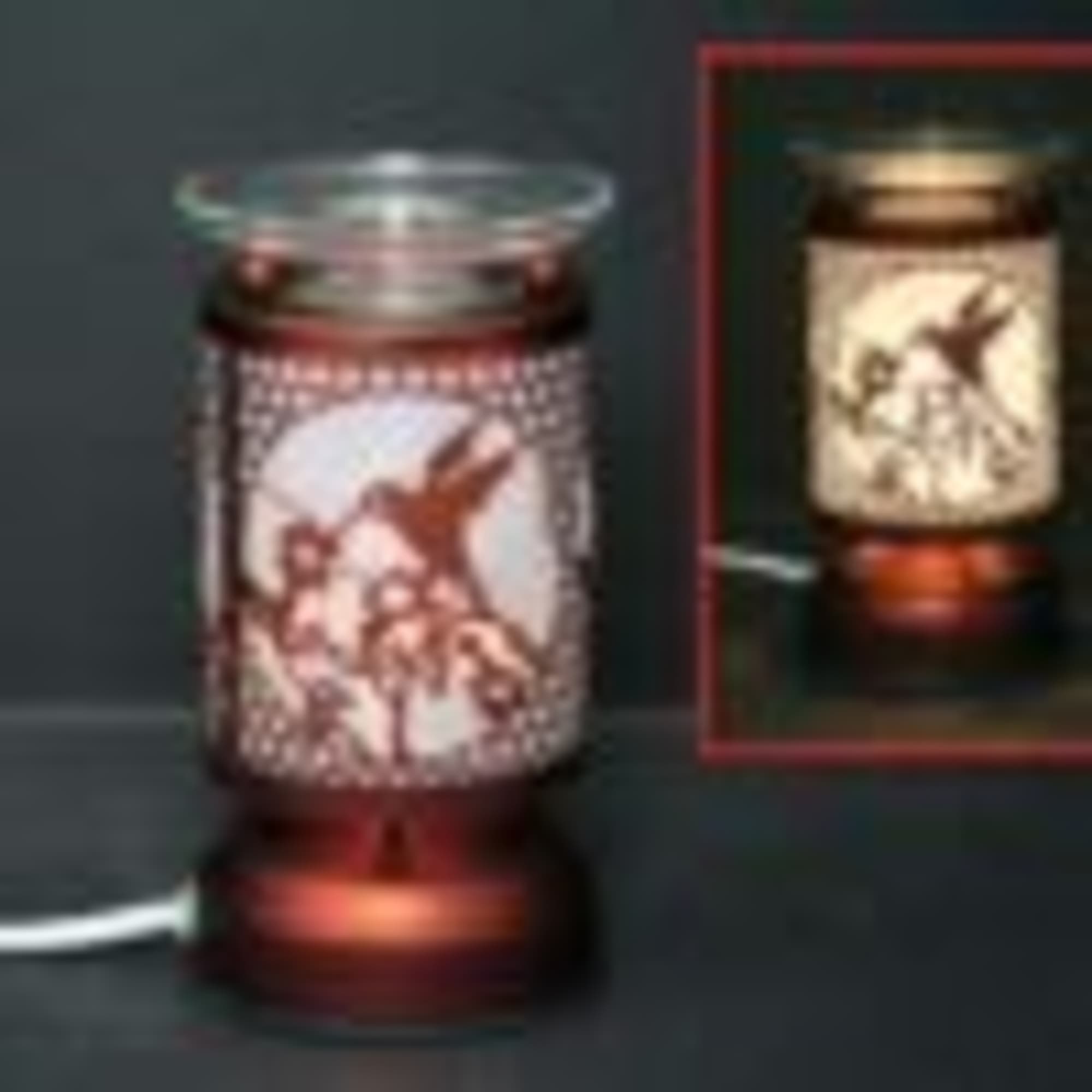 Decorative candle warmer with a floral bird design