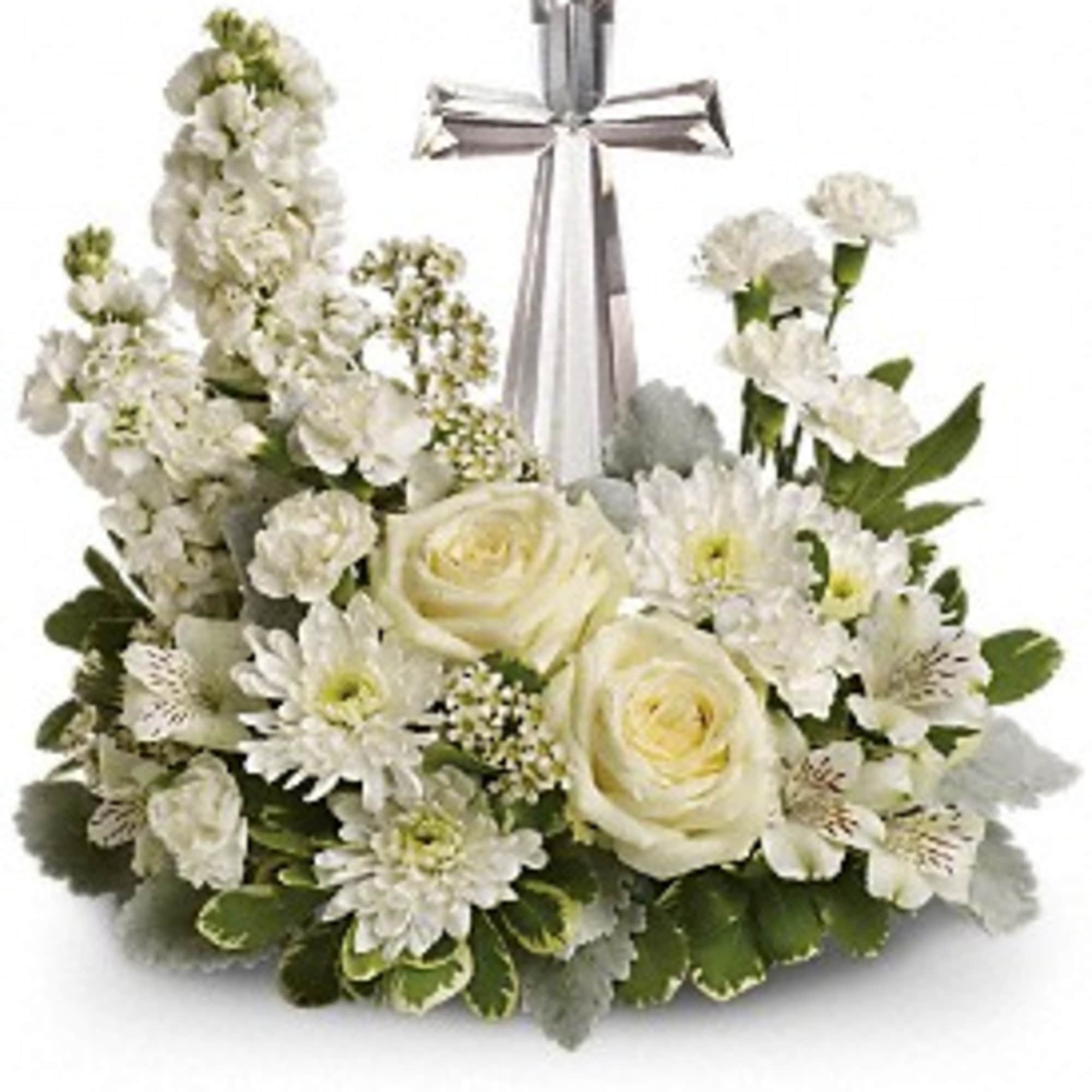 White floral arrangement with roses and daisies around a silver cross