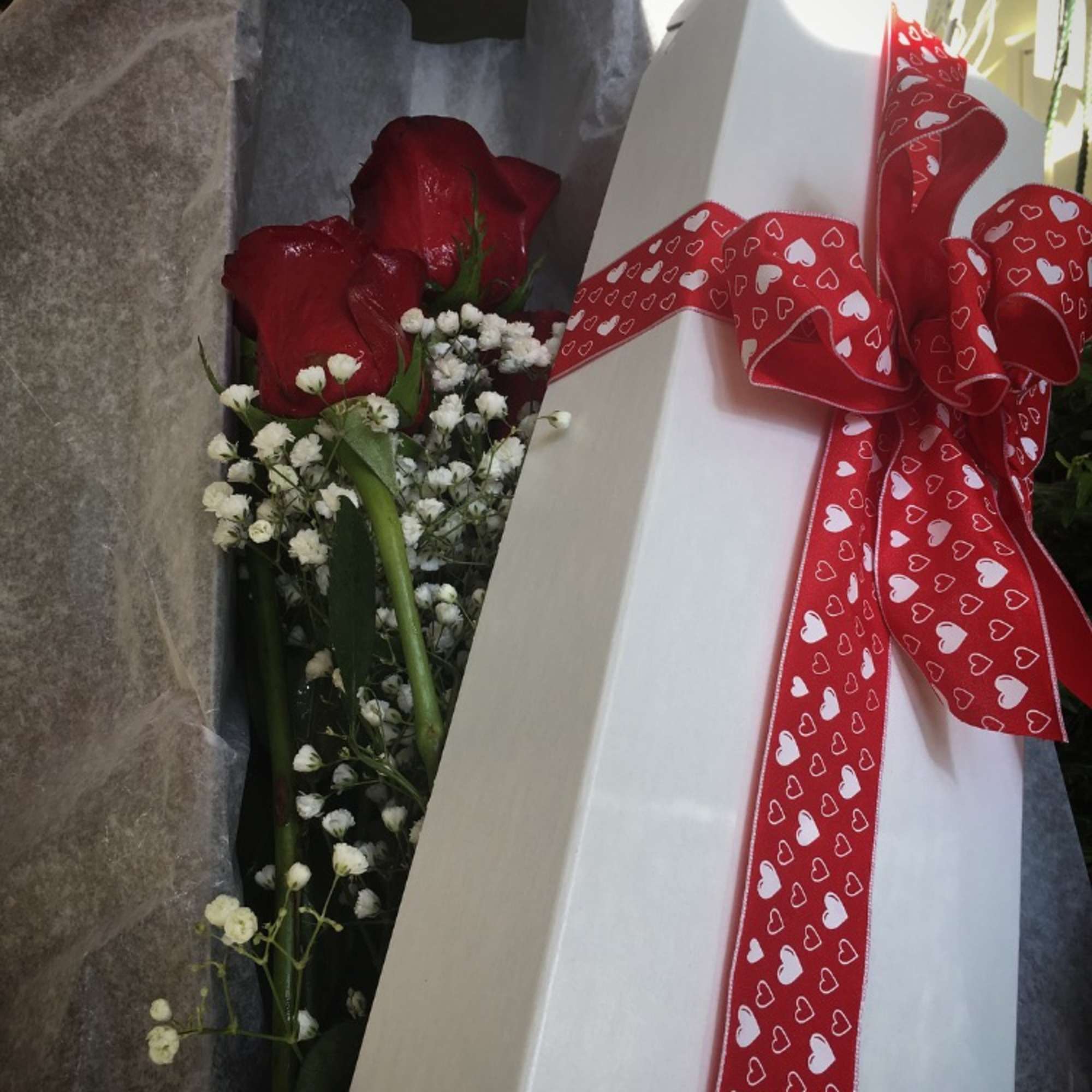 1 dozen of the highest quality long stem roses arranged with beautiful