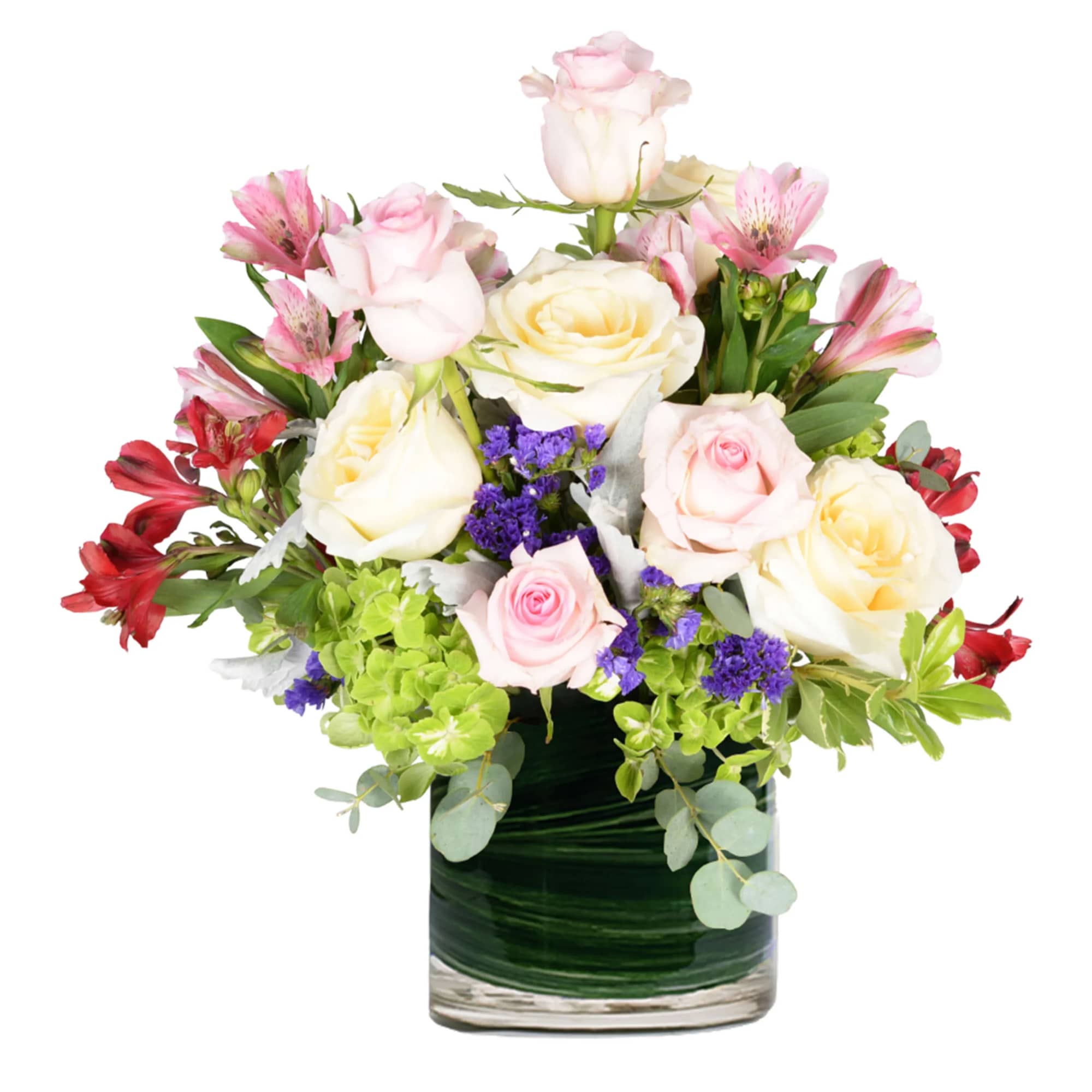 Mixed roses and alstroemeria in a glass vase