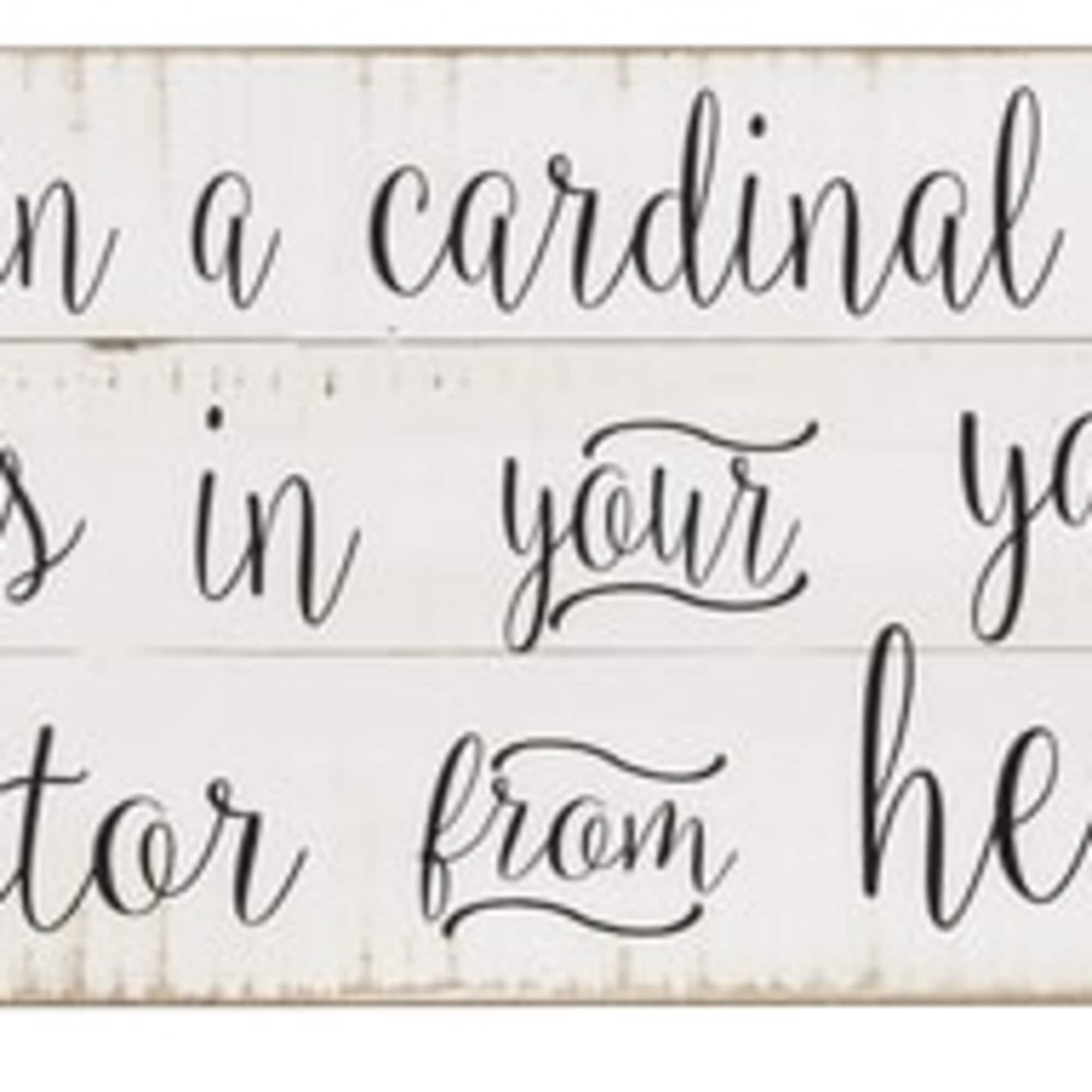Wooden sign with a cardinal and a memorial quote