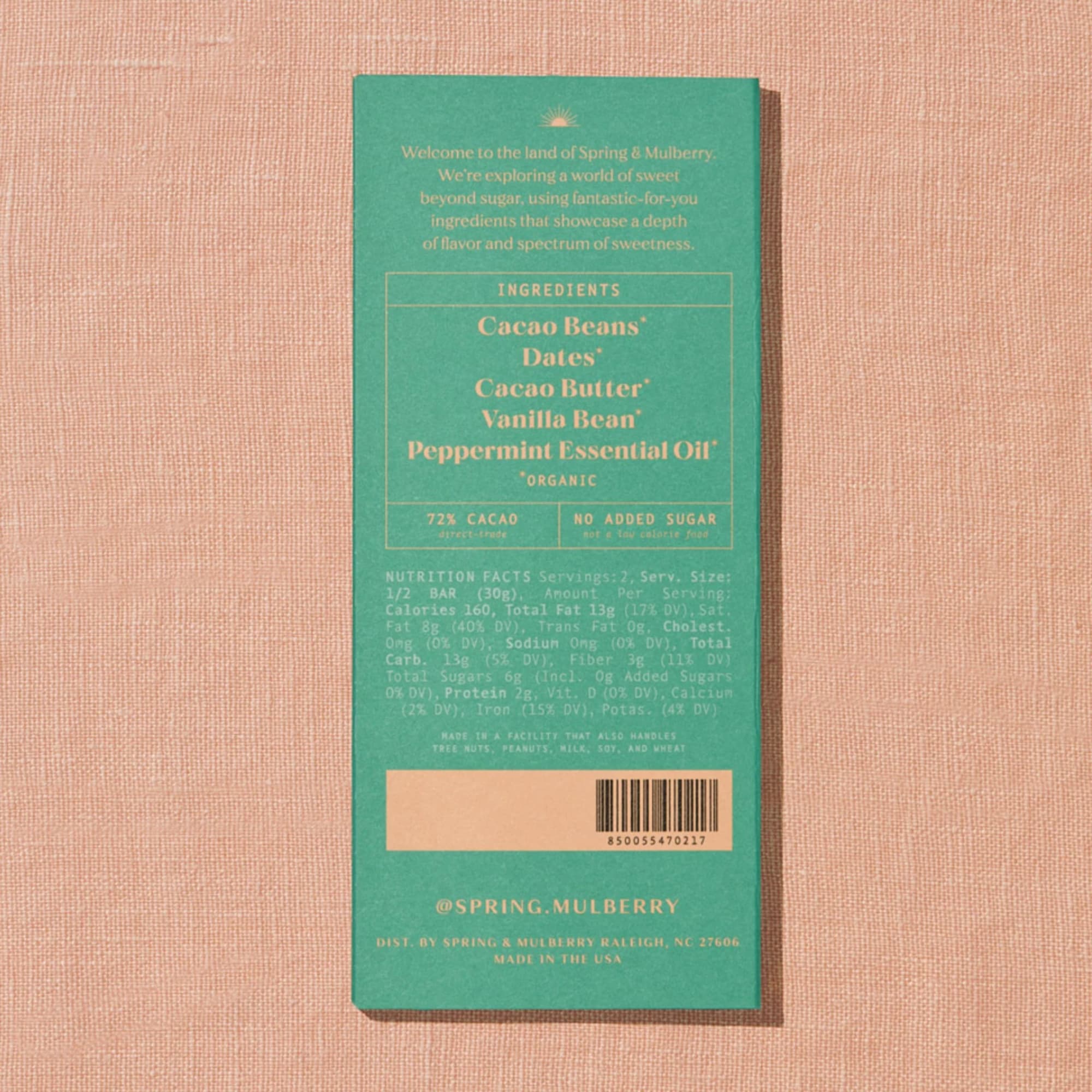 Green chocolate bar package on a peach textured background
