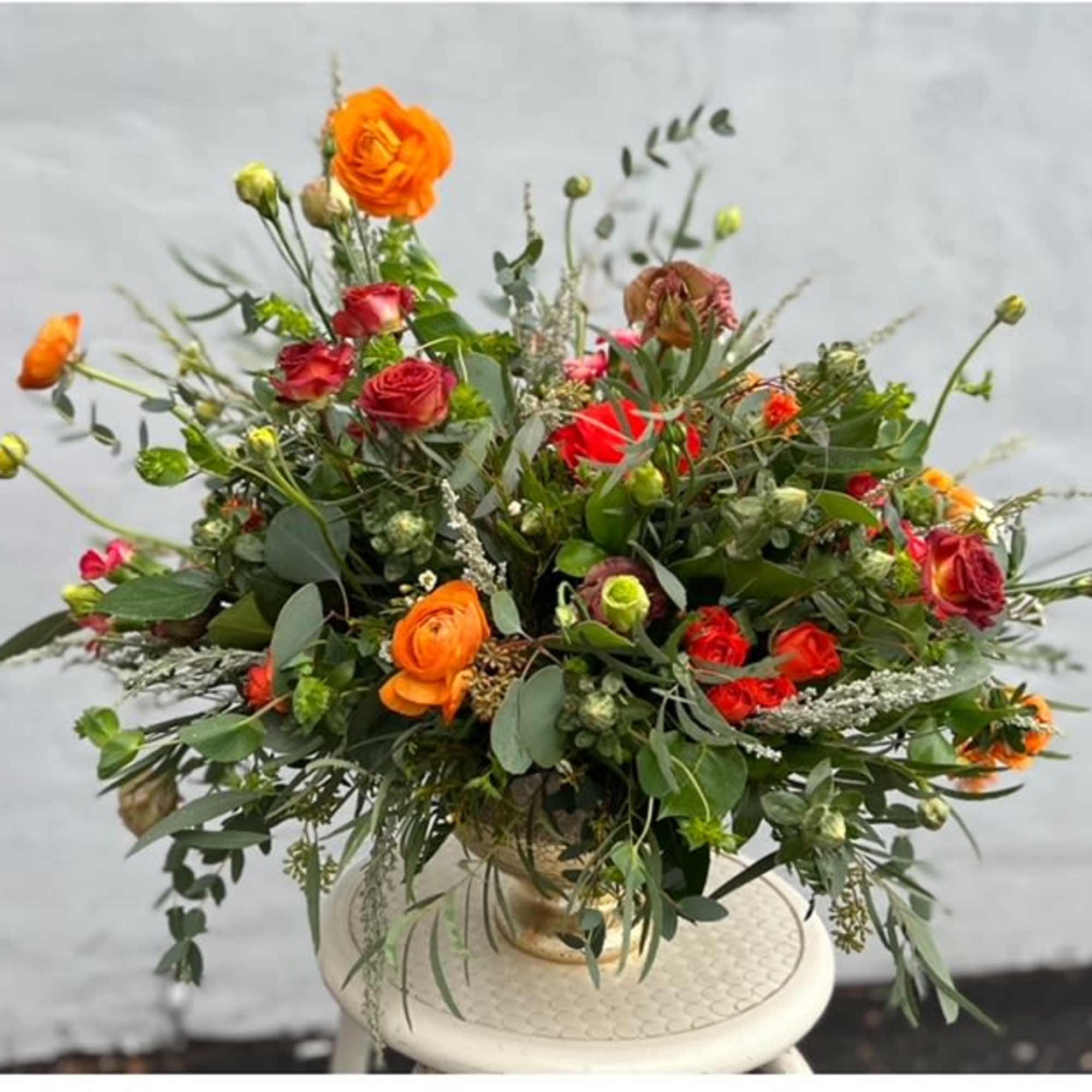 Bring nature's vibrant hues to life with our Vibrant Sunset Garden Centerpiece