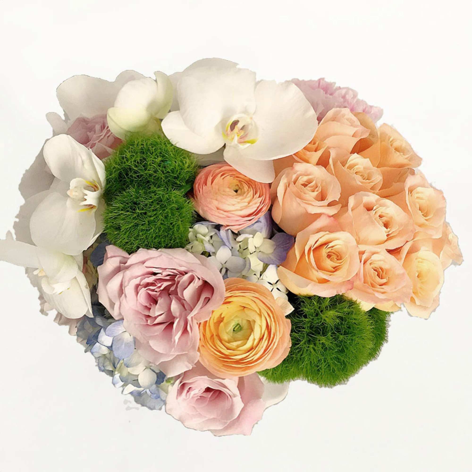 A rainbow of pastel colored flowers in a beautiful white porcelain pedestal