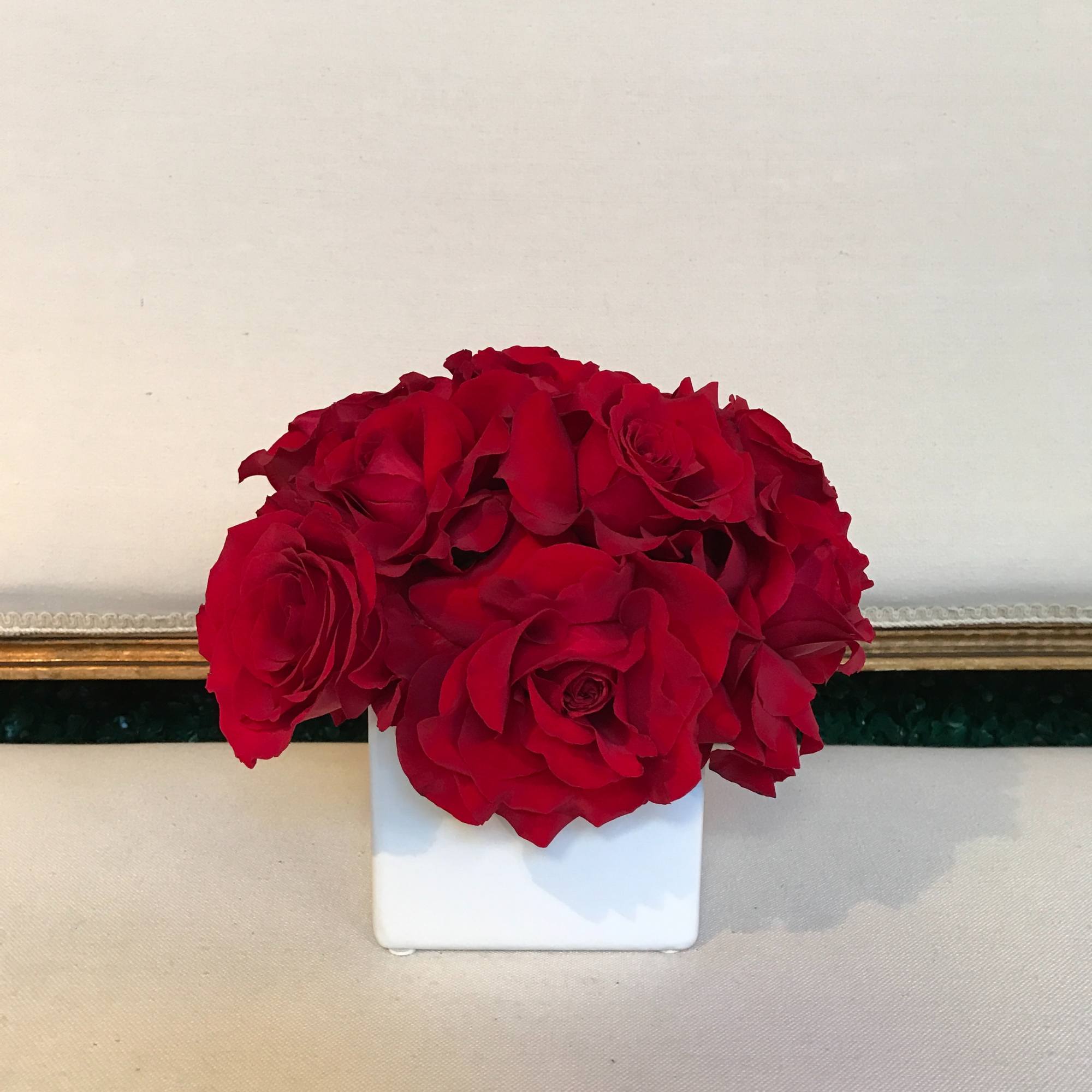 Classic Pave of red roses in modern vase. This arrangement is approximately, photo 2 of 2