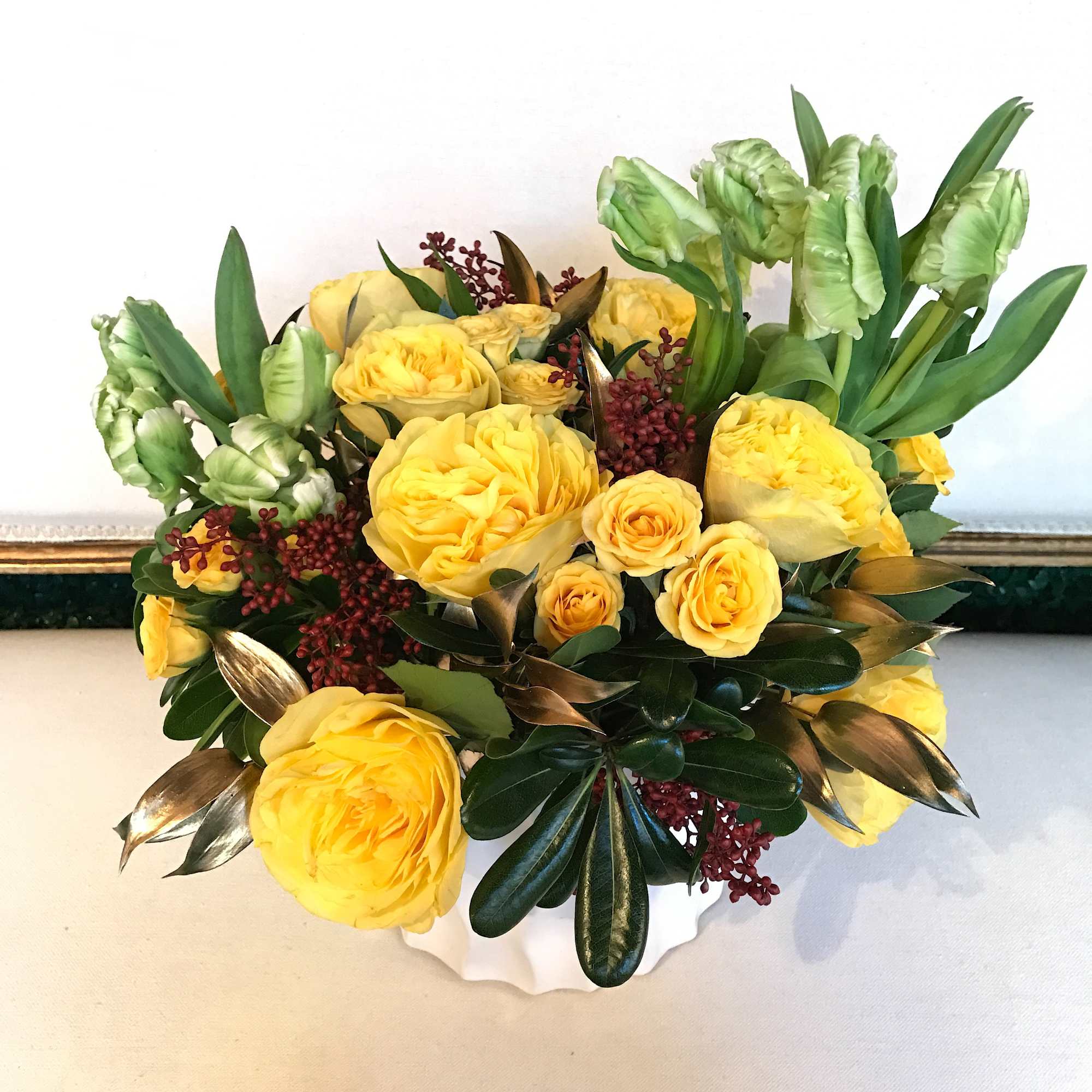 Yellow roses and green tulips in a white vase, photo 2 of 2