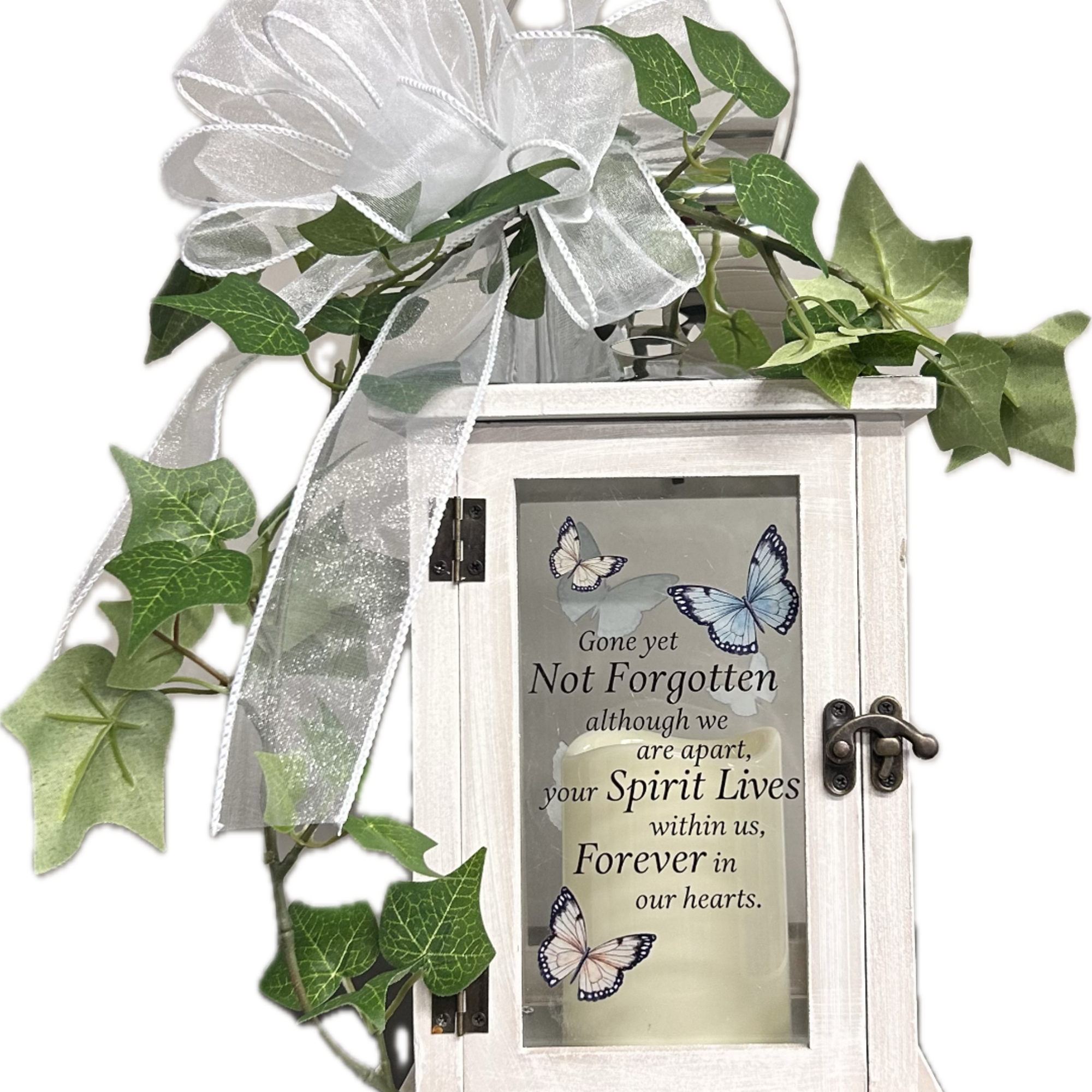 White memorial lantern with ribbon and ivy