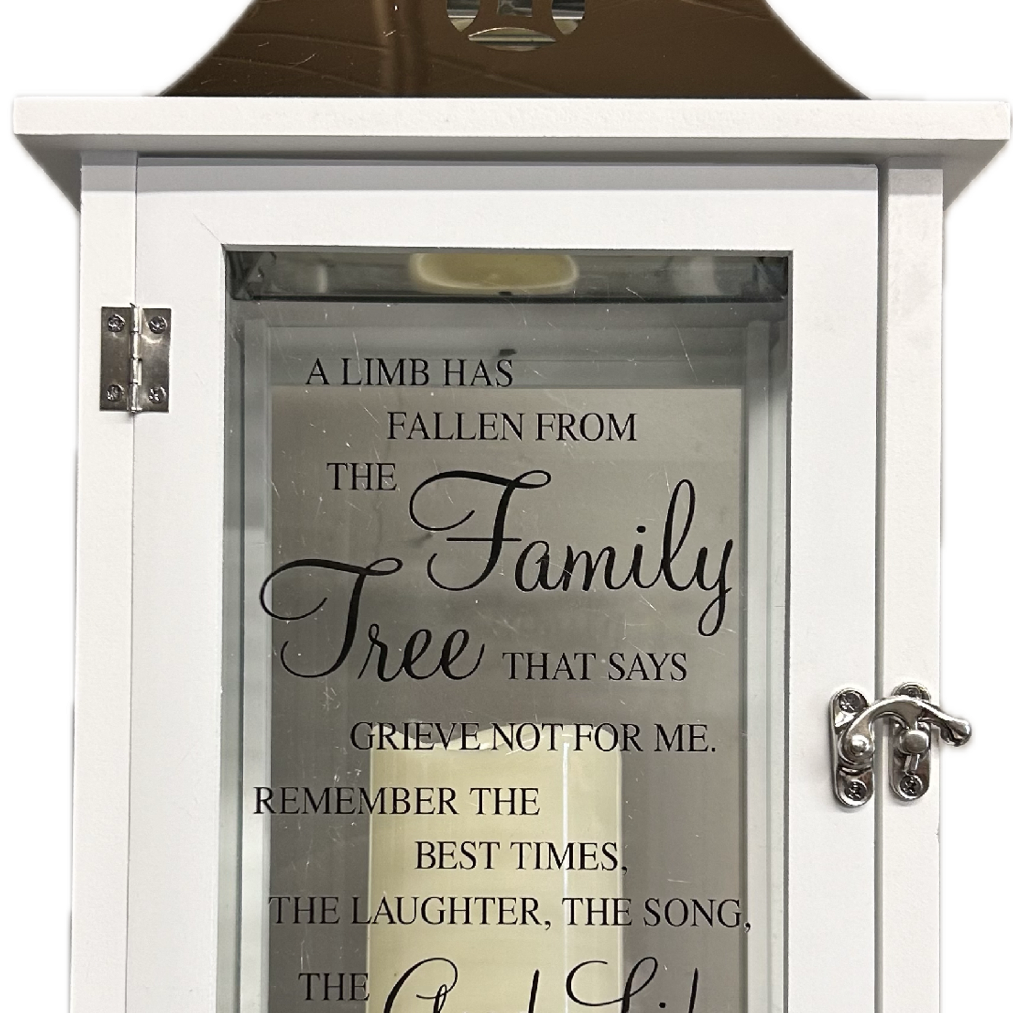 White memorial lantern with a candle and sympathy quote inside