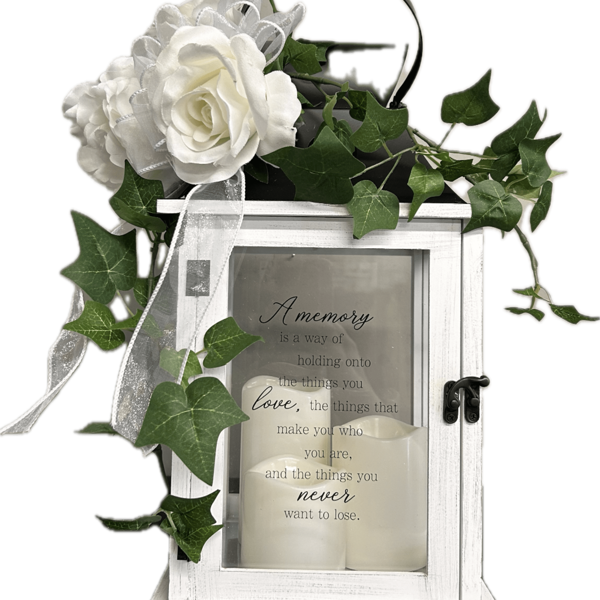 White floral lantern with candles and ivy accents