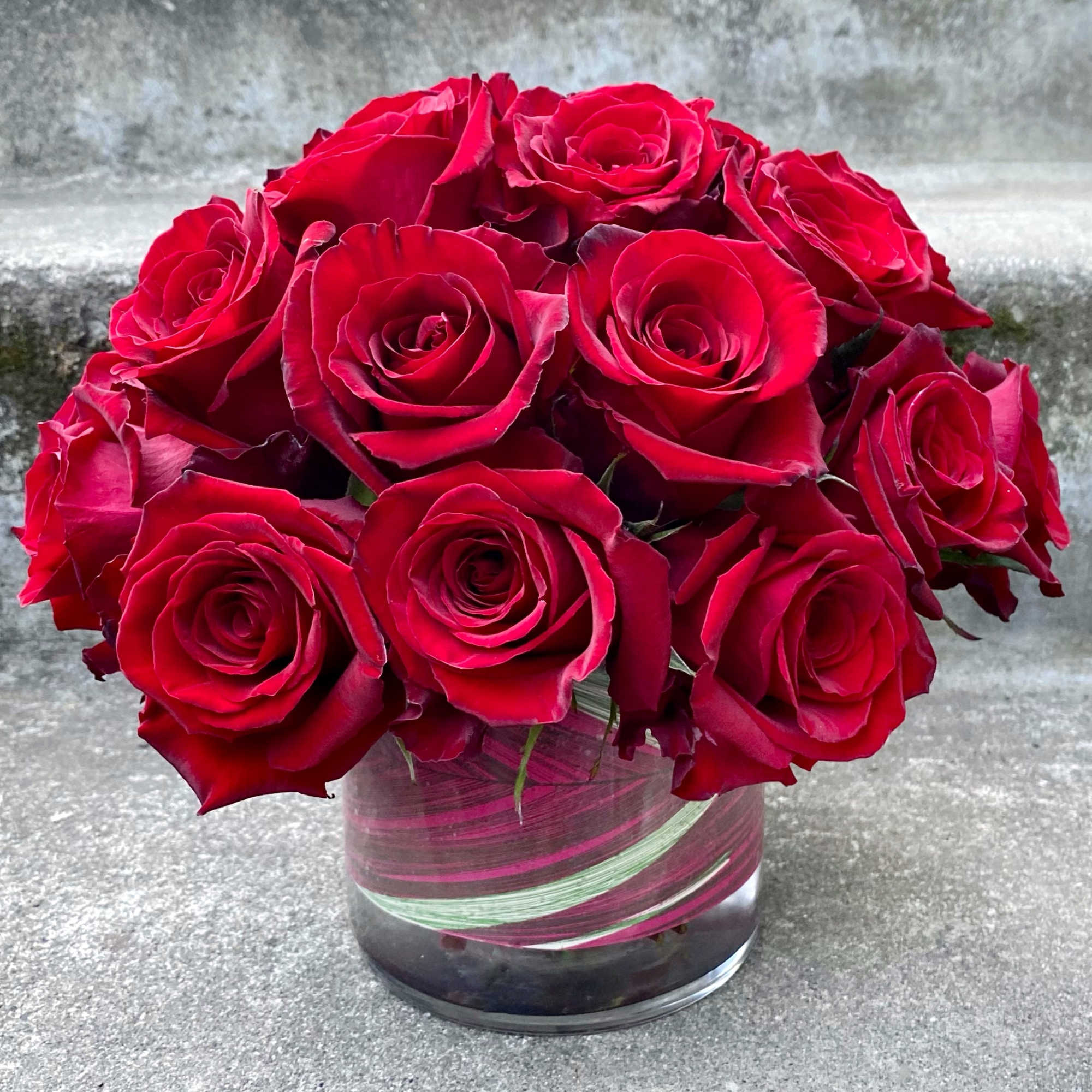 Bouquet of red roses in a clear glass vase