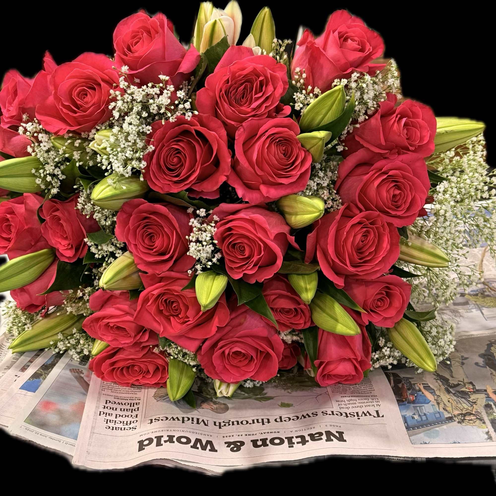 Bouquet of red roses with white filler and lily buds