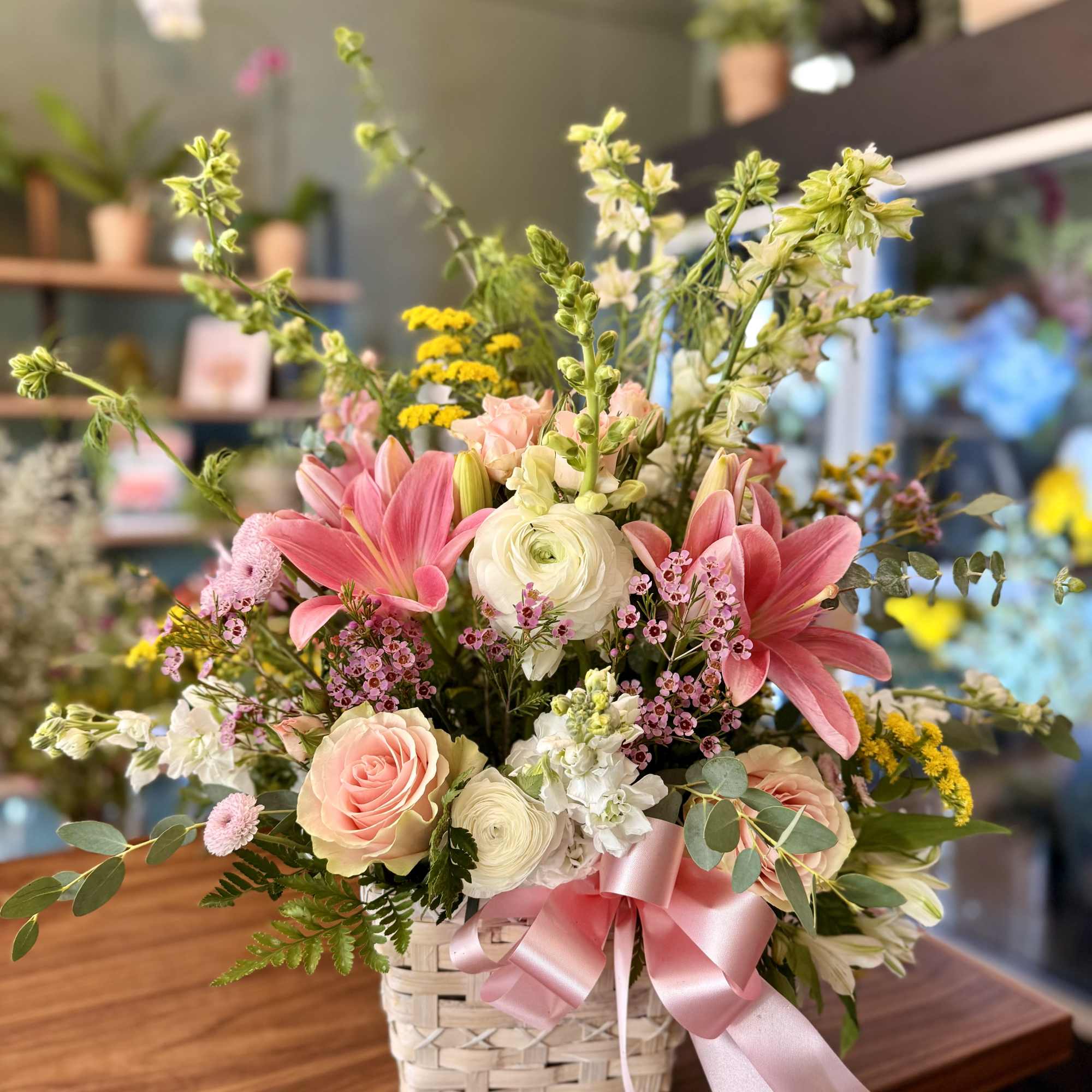 Brighten any occasion with this pink, yellow, and white floral basket, featuring, photo 2 of 2