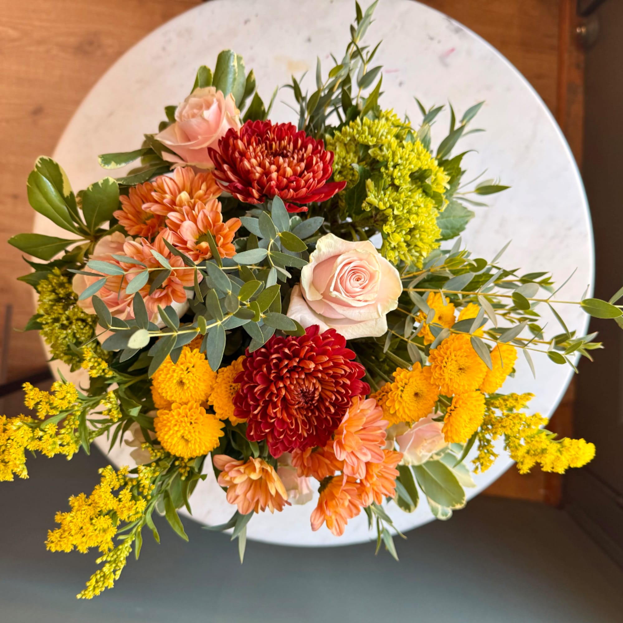 Mixed bouquet of roses, chrysanthemums, and yellow filler flowers