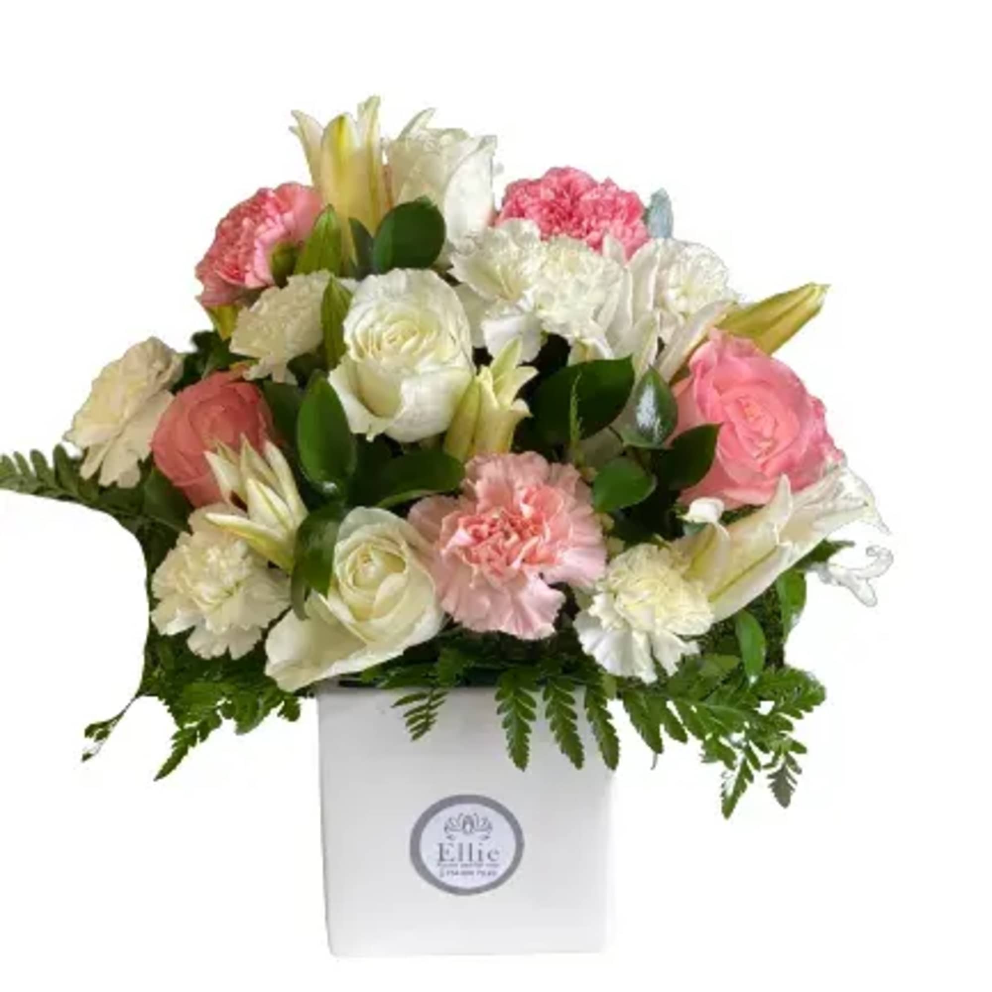 Pink and white floral arrangement in a white box