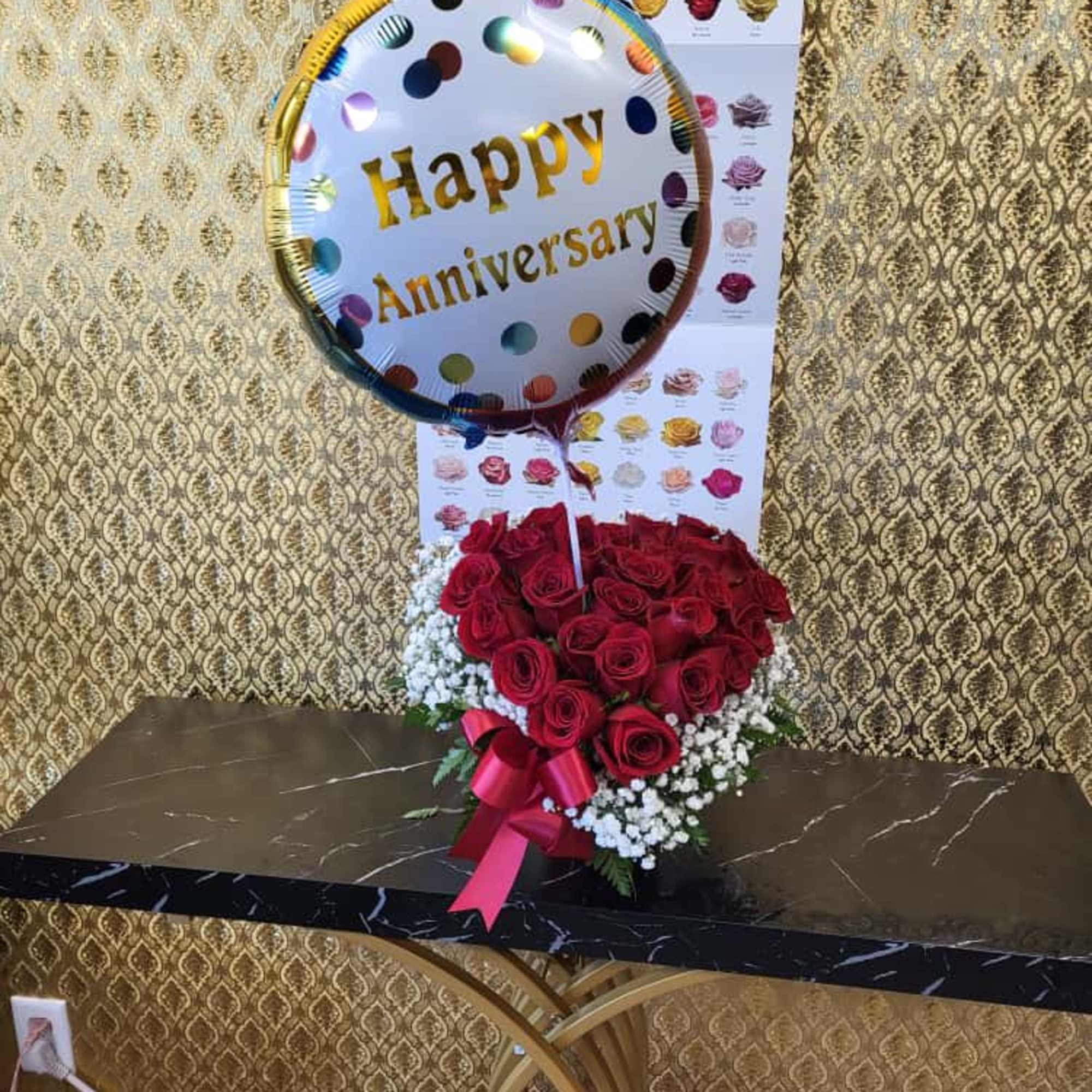 Ellie Flowers exclusive, heart shaped designed in a round hat red box