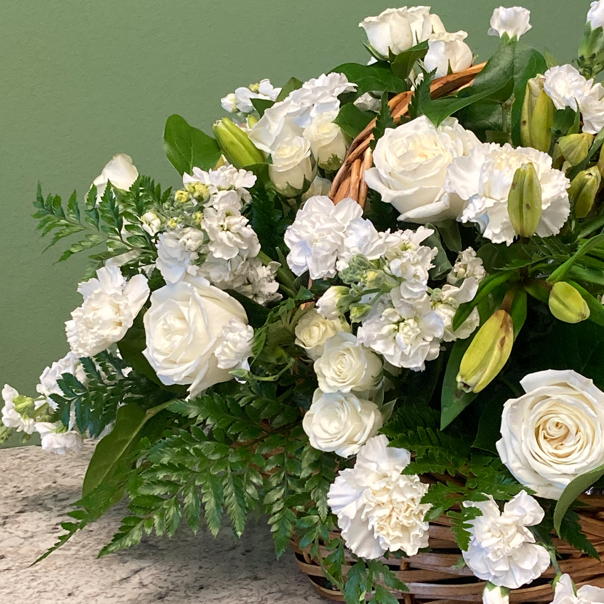 A tranquil mixed arrangement that arrives in a natural wicker basket, showcasing, photo 2 of 3