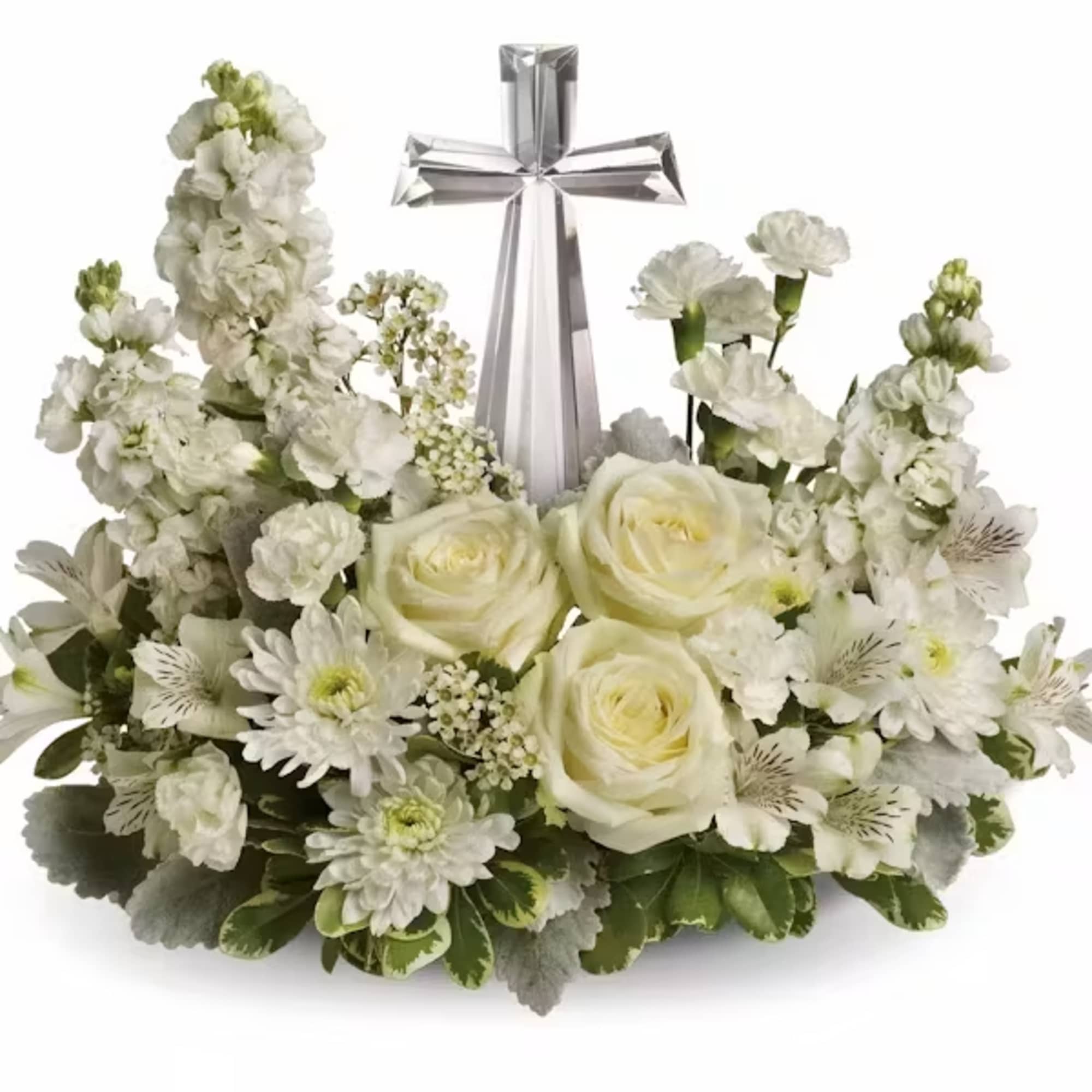 White floral arrangement with a silver cross centerpiece