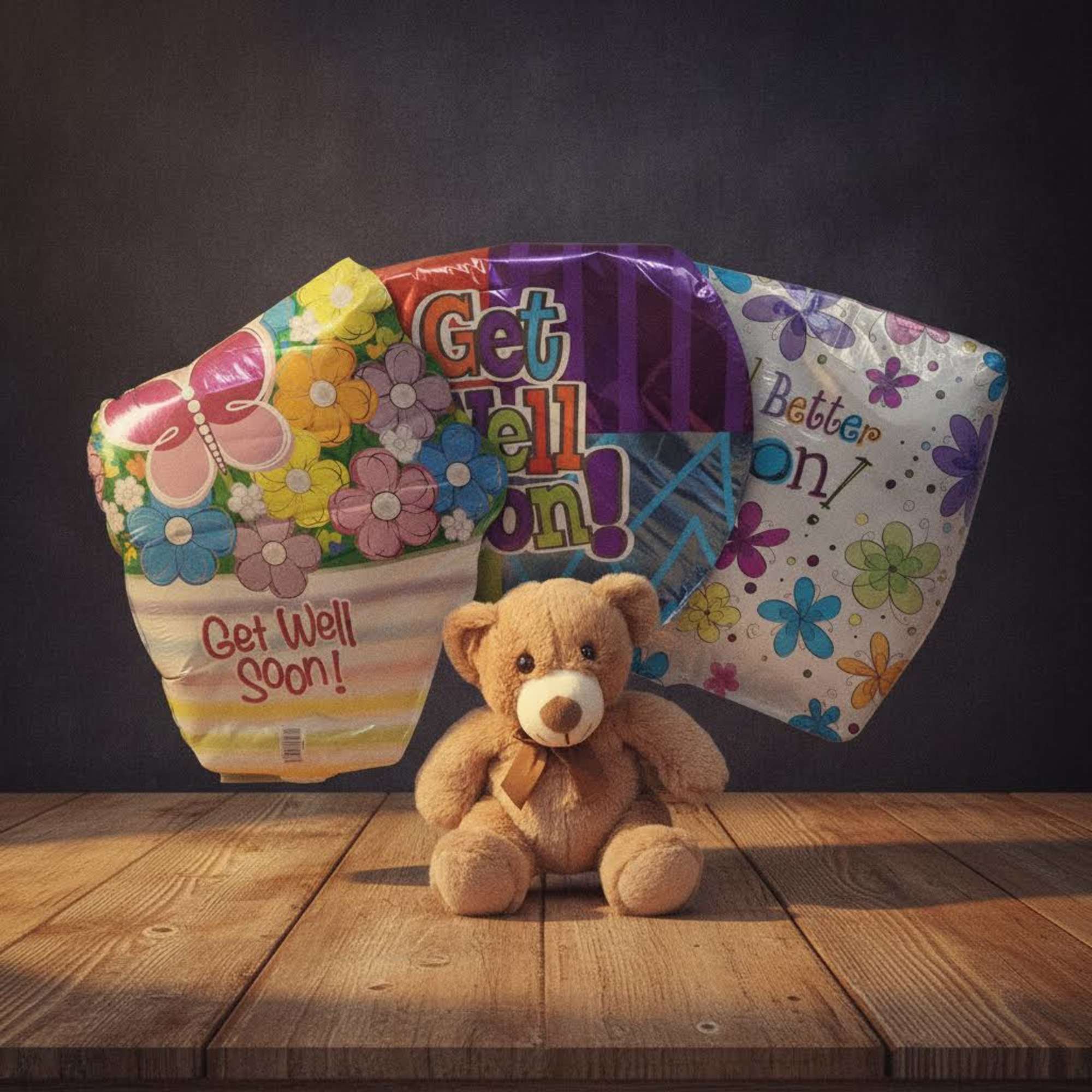 Get-well balloon bouquet with a teddy bear in front