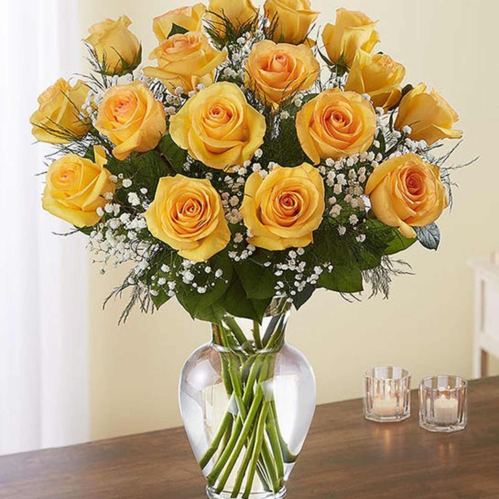 Yellow roses arranged in a clear glass vase