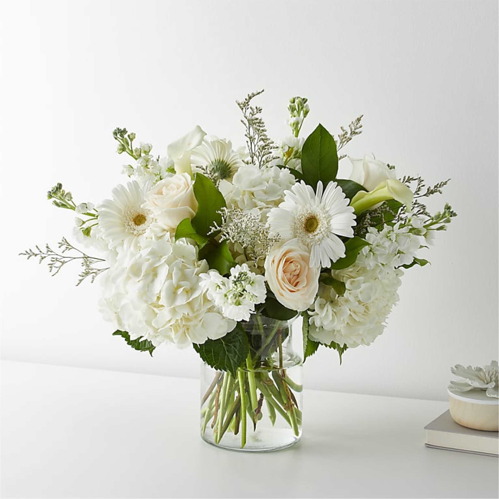 White flowers arranged in a clear glass vase