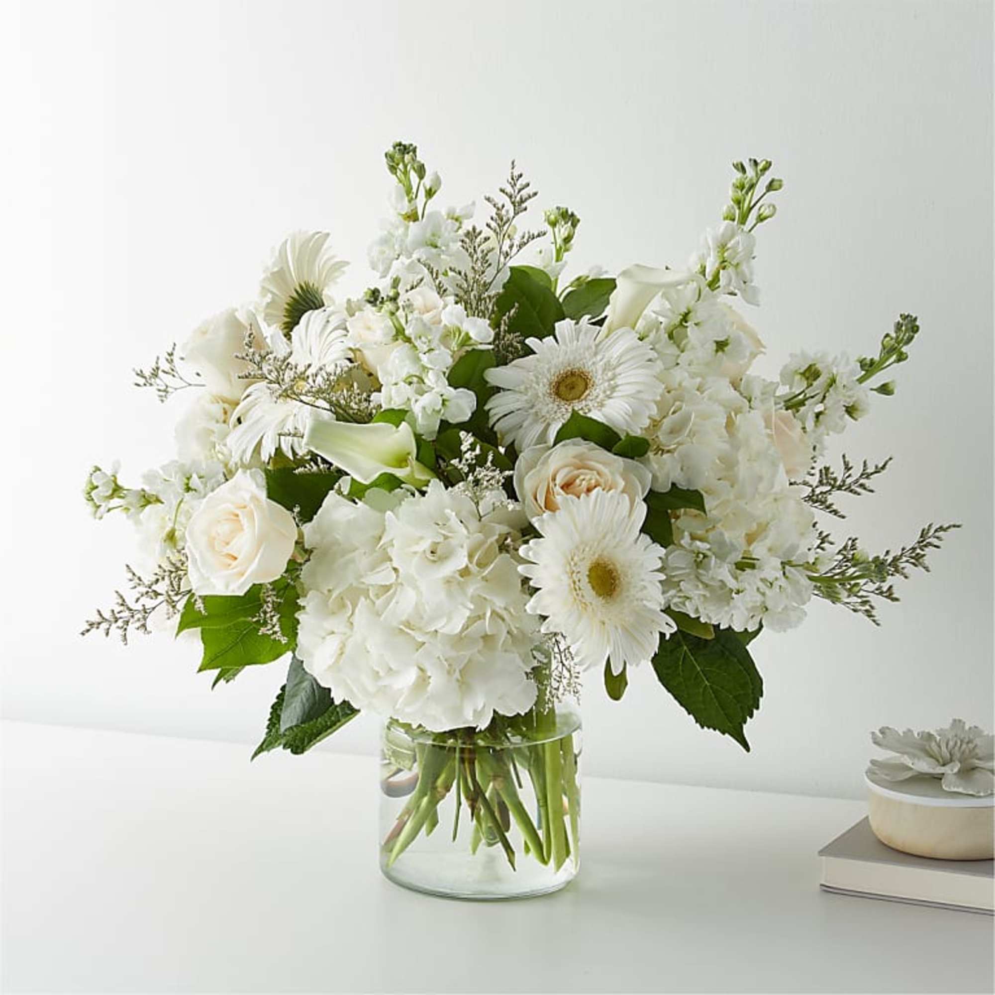 White floral bouquet in a clear glass vase