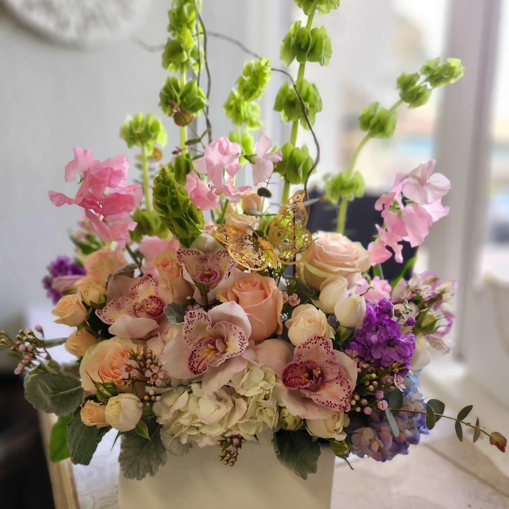 A vertical design with seasonal spring flowers in pastel mix Flowers may, photo 2 of 2