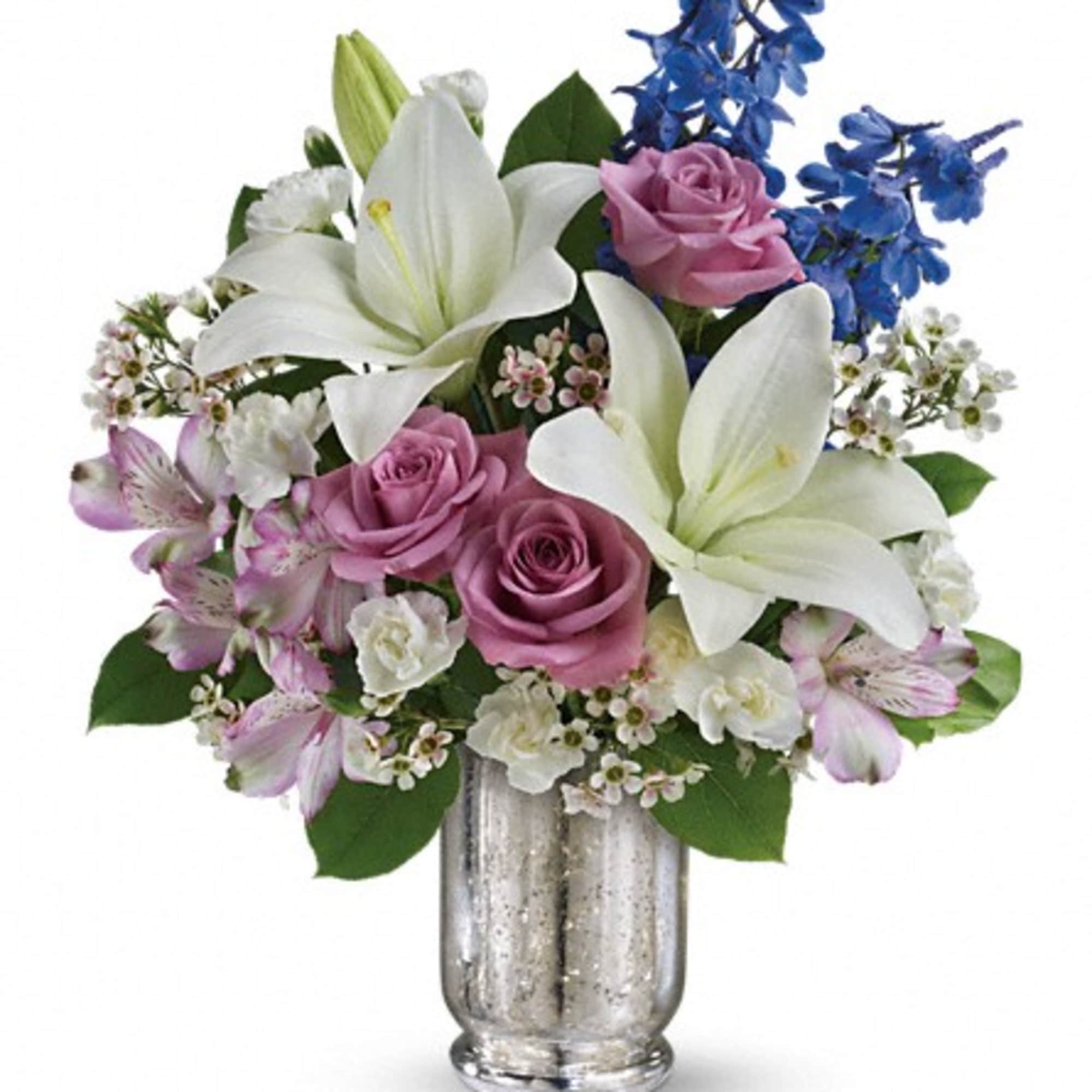 Pink roses and white lilies in a silver vase