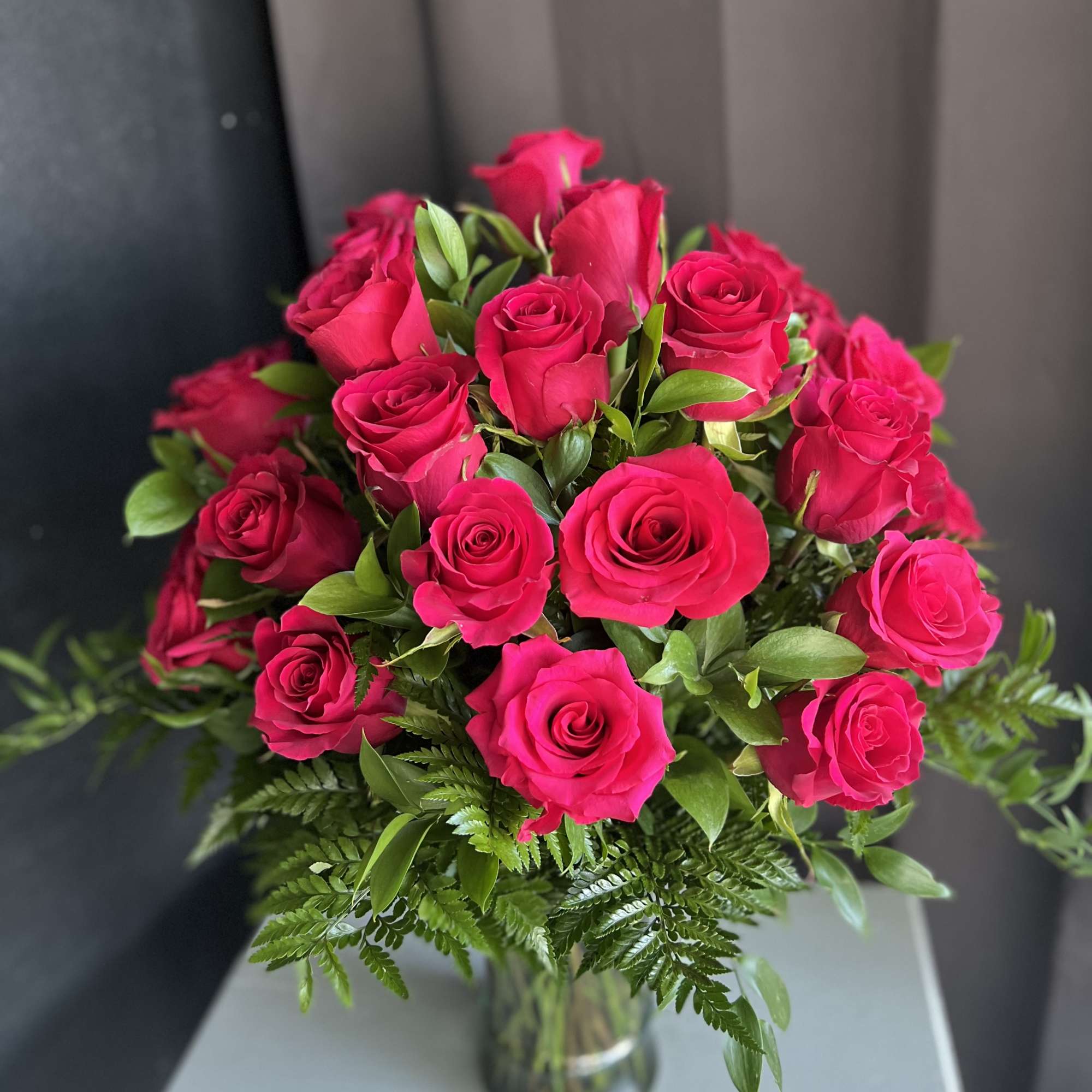 12 Hot Pink roses designed in a traditional style.
, photo 2 of 2