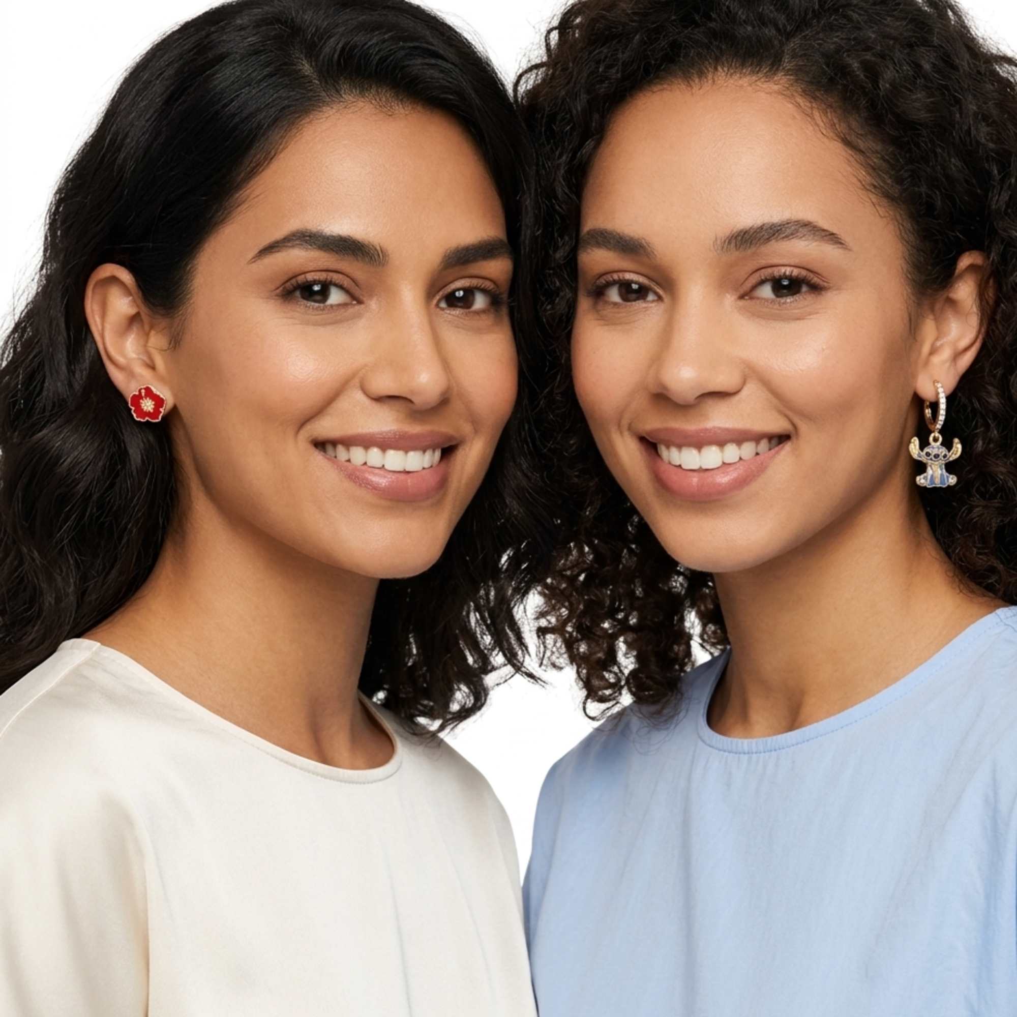 Two women wearing floral earrings against a white background