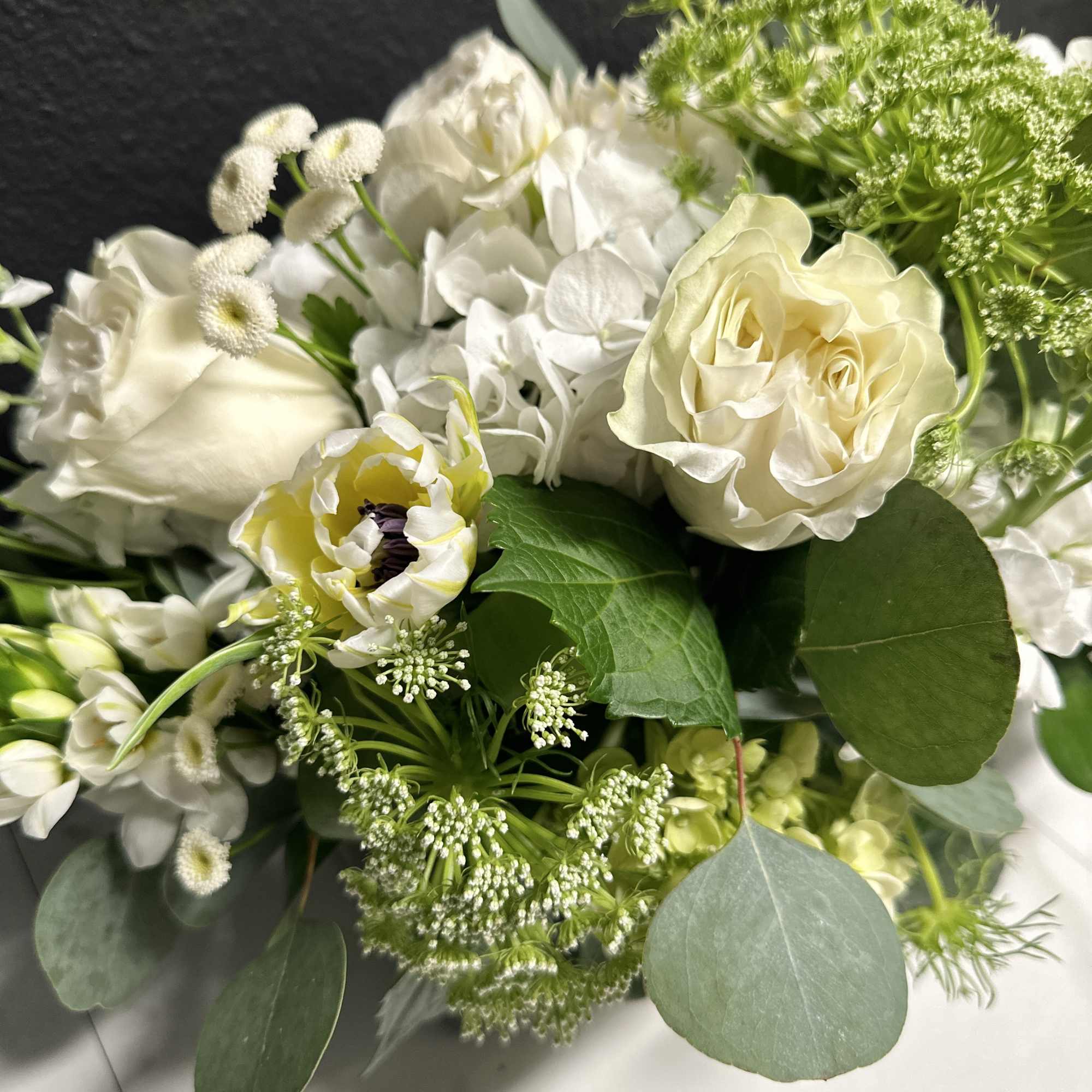 White floral bouquet with roses and mixed blooms