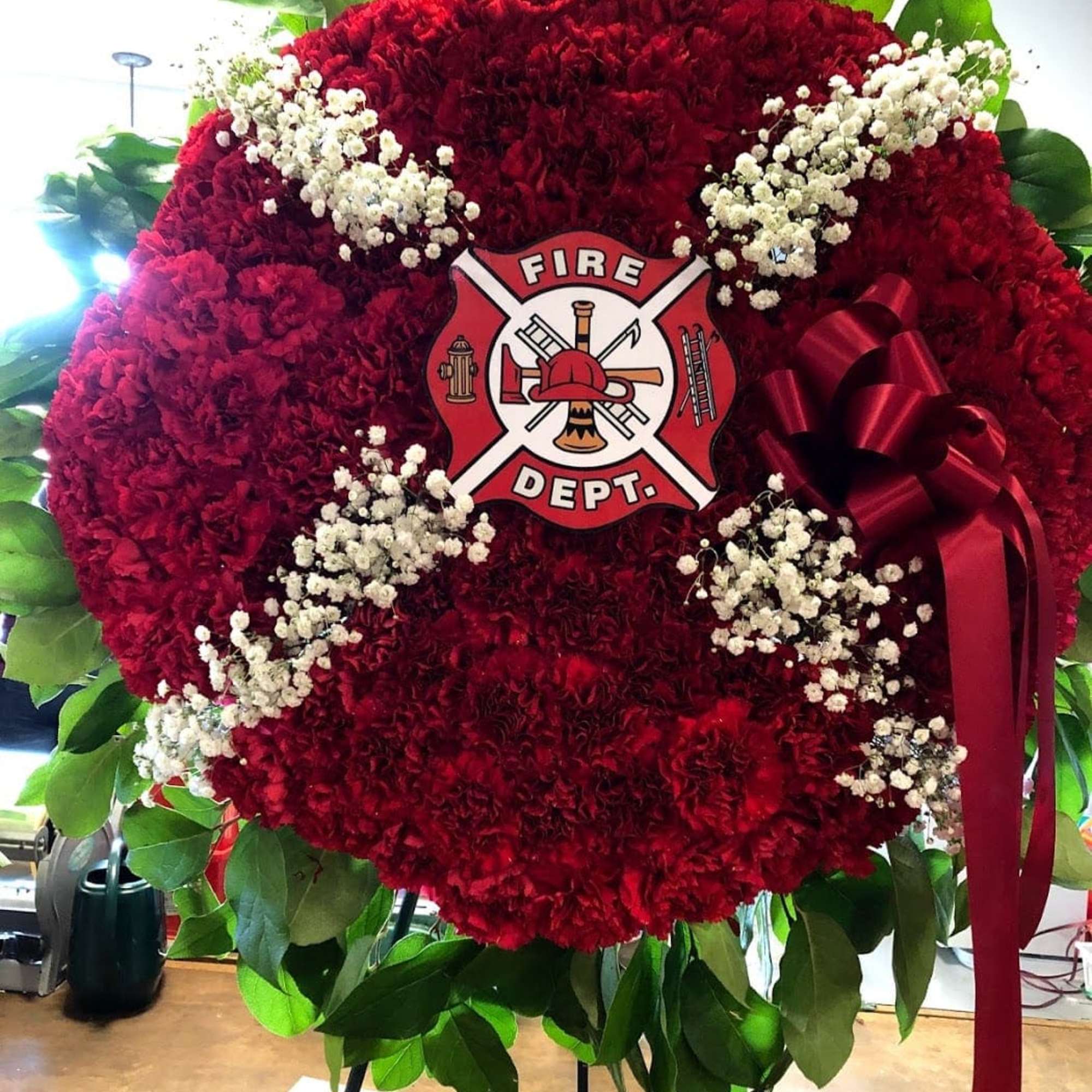 Red floral fire department wreath with white baby's breath and a ribbon, photo 2 of 2
