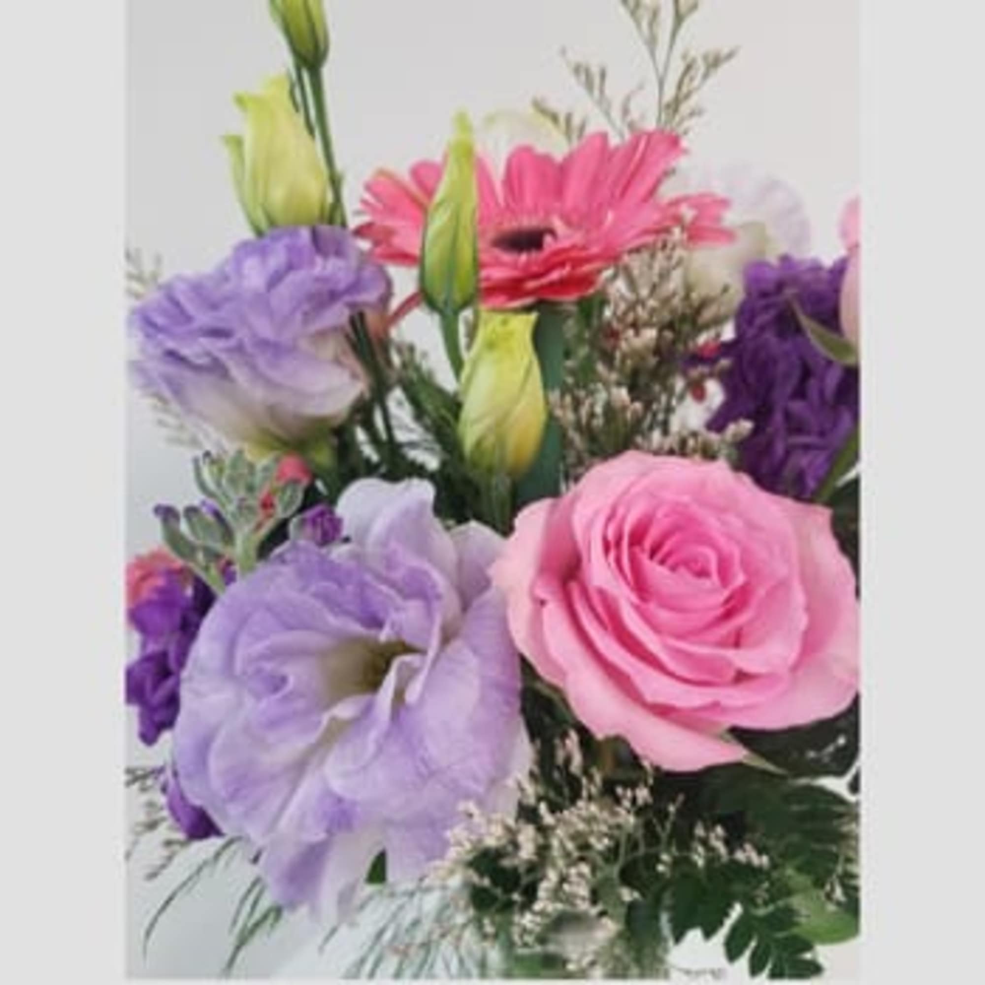 Bouquet of pink, purple, and lavender flowers with green buds