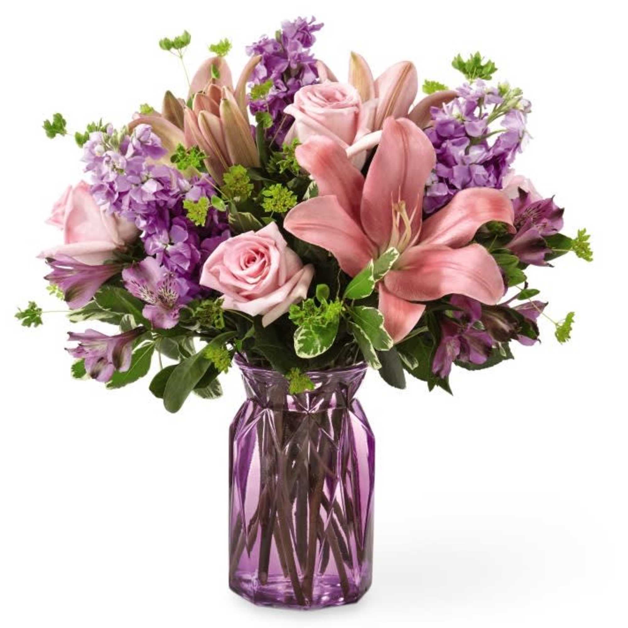 Pink and purple mixed bouquet in a purple glass vase