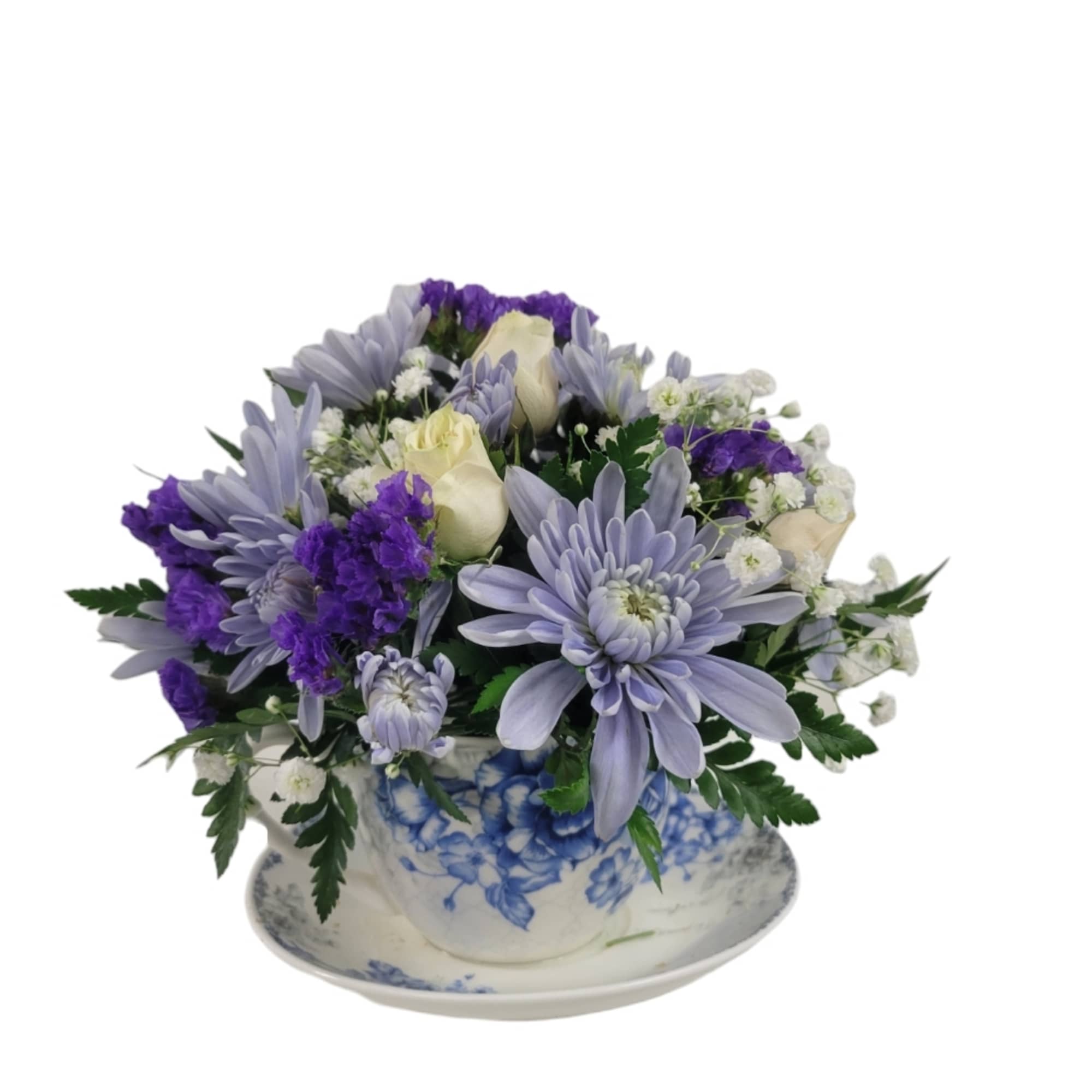 Lavender and white bouquet in a blue-and-white teacup and saucer