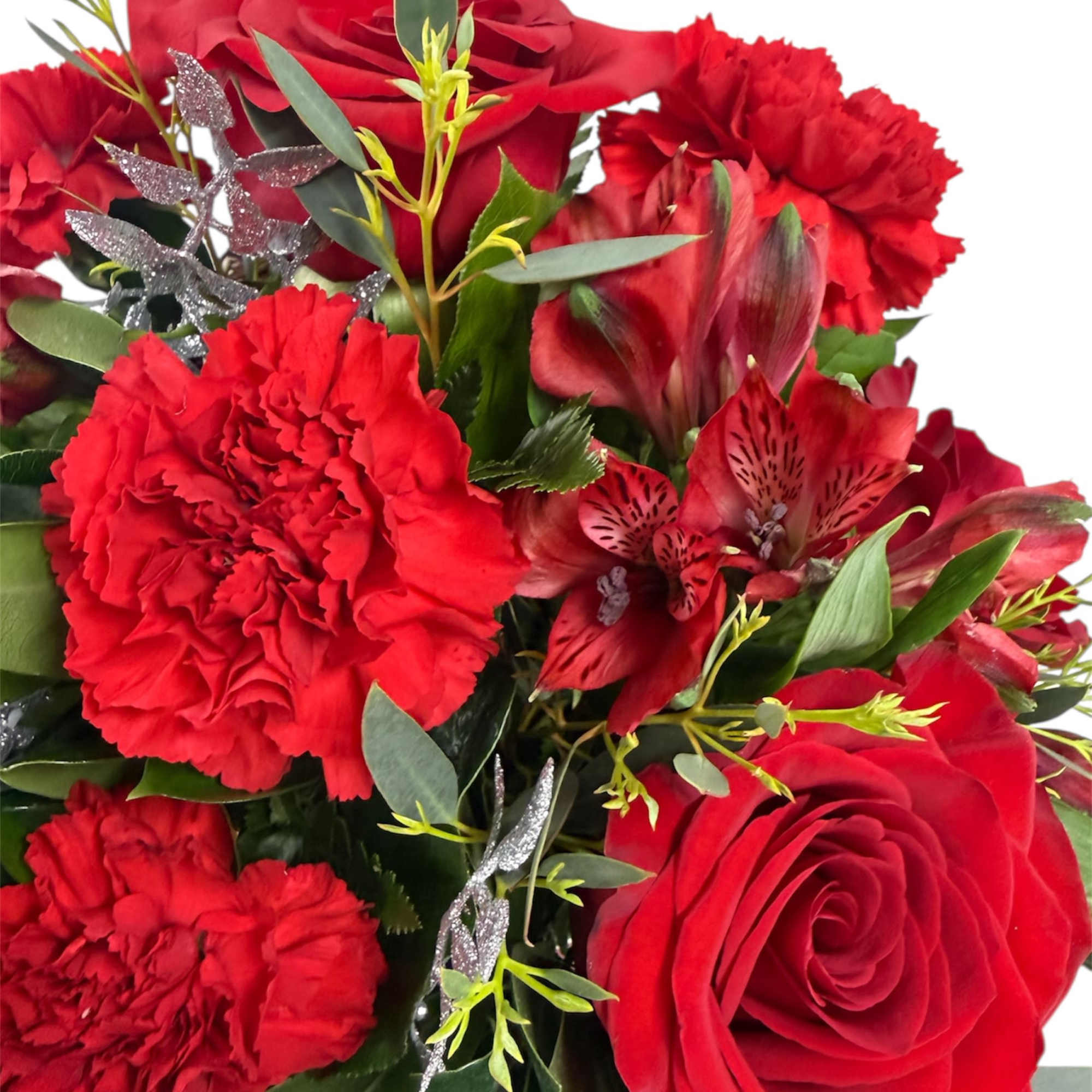 Red roses and carnations with red alstroemeria in a bouquet