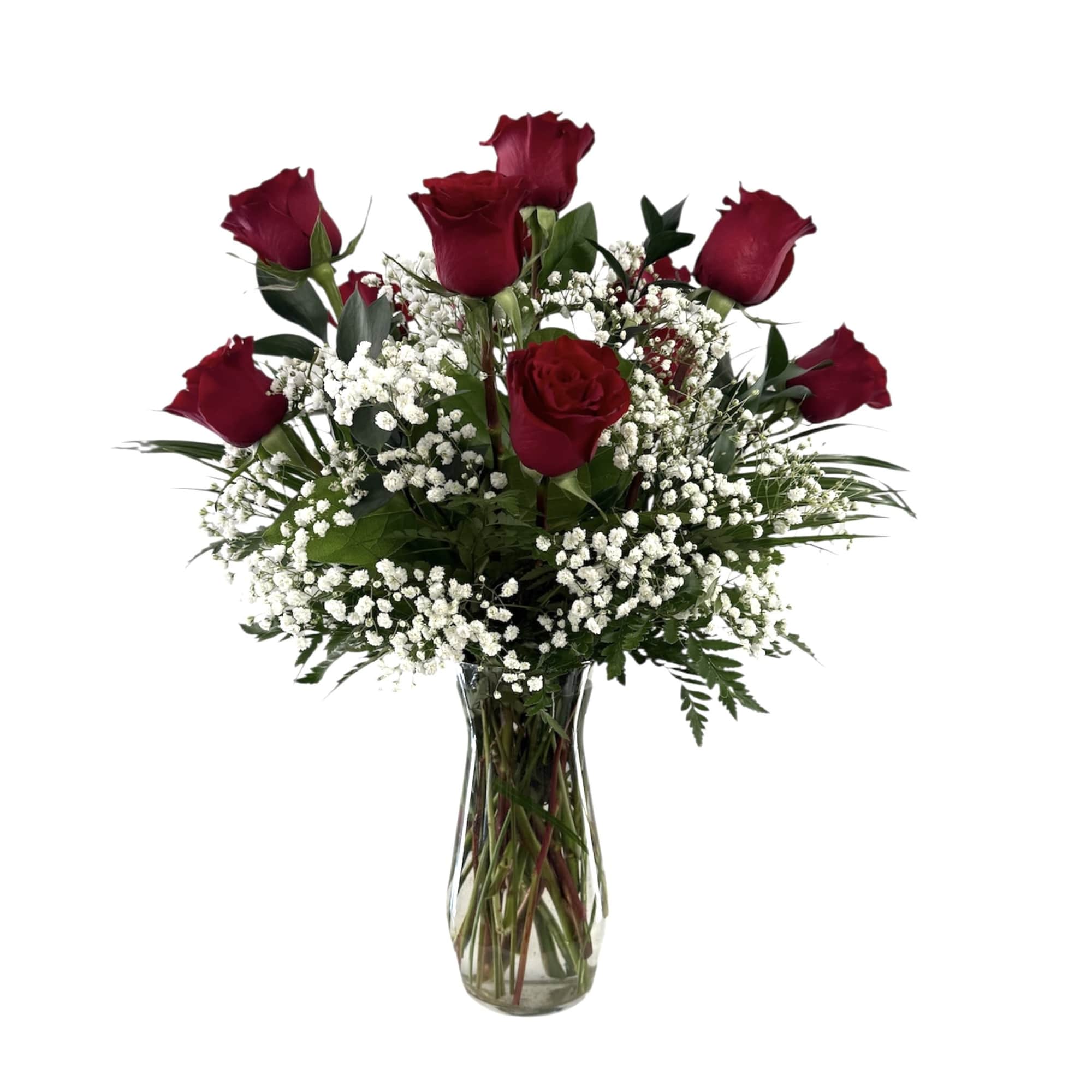 Red roses and baby's breath in a clear glass vase
