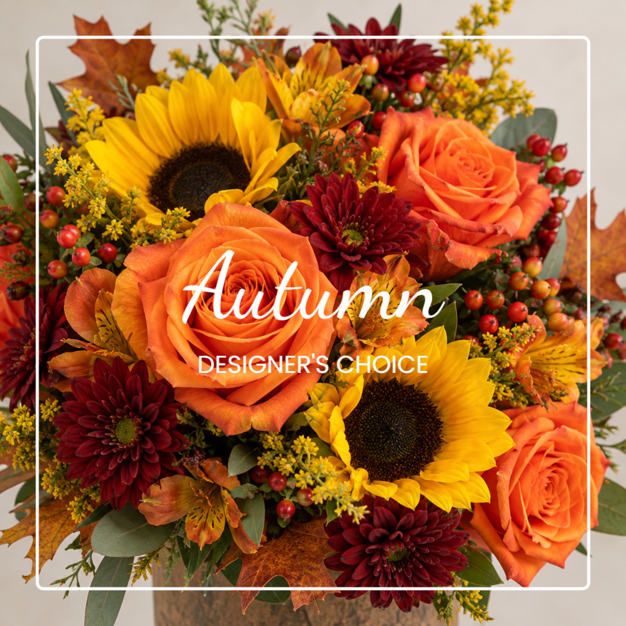 Autumn bouquet with orange roses, sunflowers, and burgundy mums