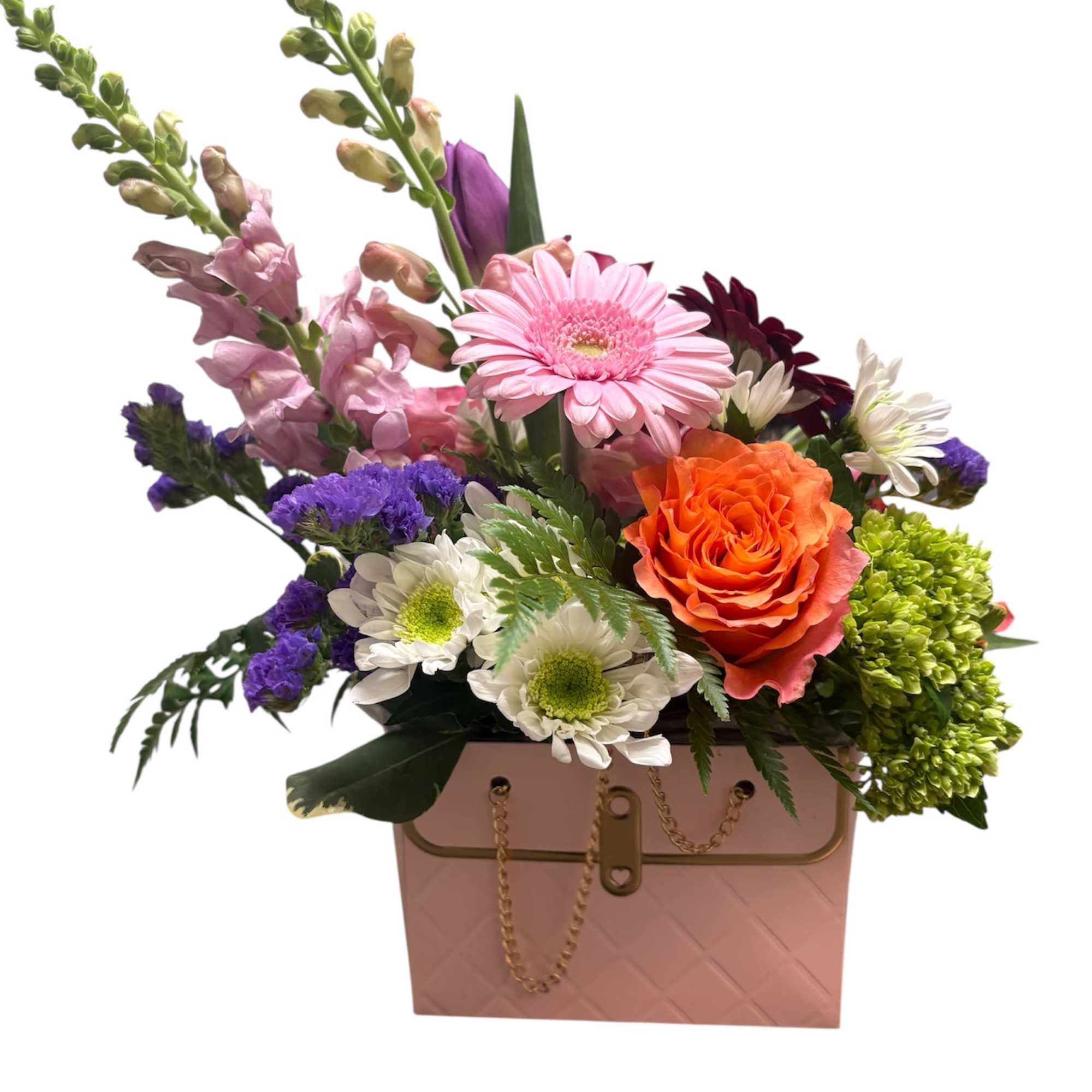 Mixed bouquet in a pink handbag-style box with orange and pink blooms