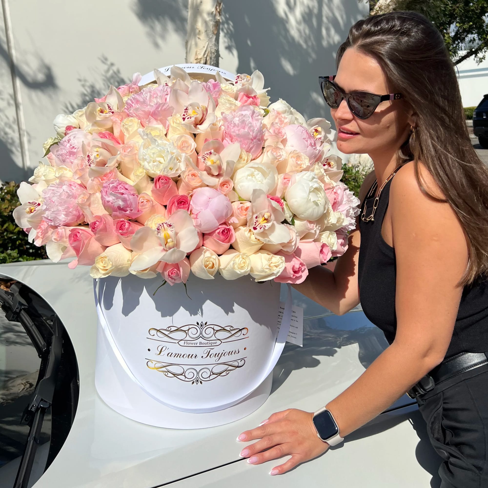 Large pastel flower box with pink and white blooms