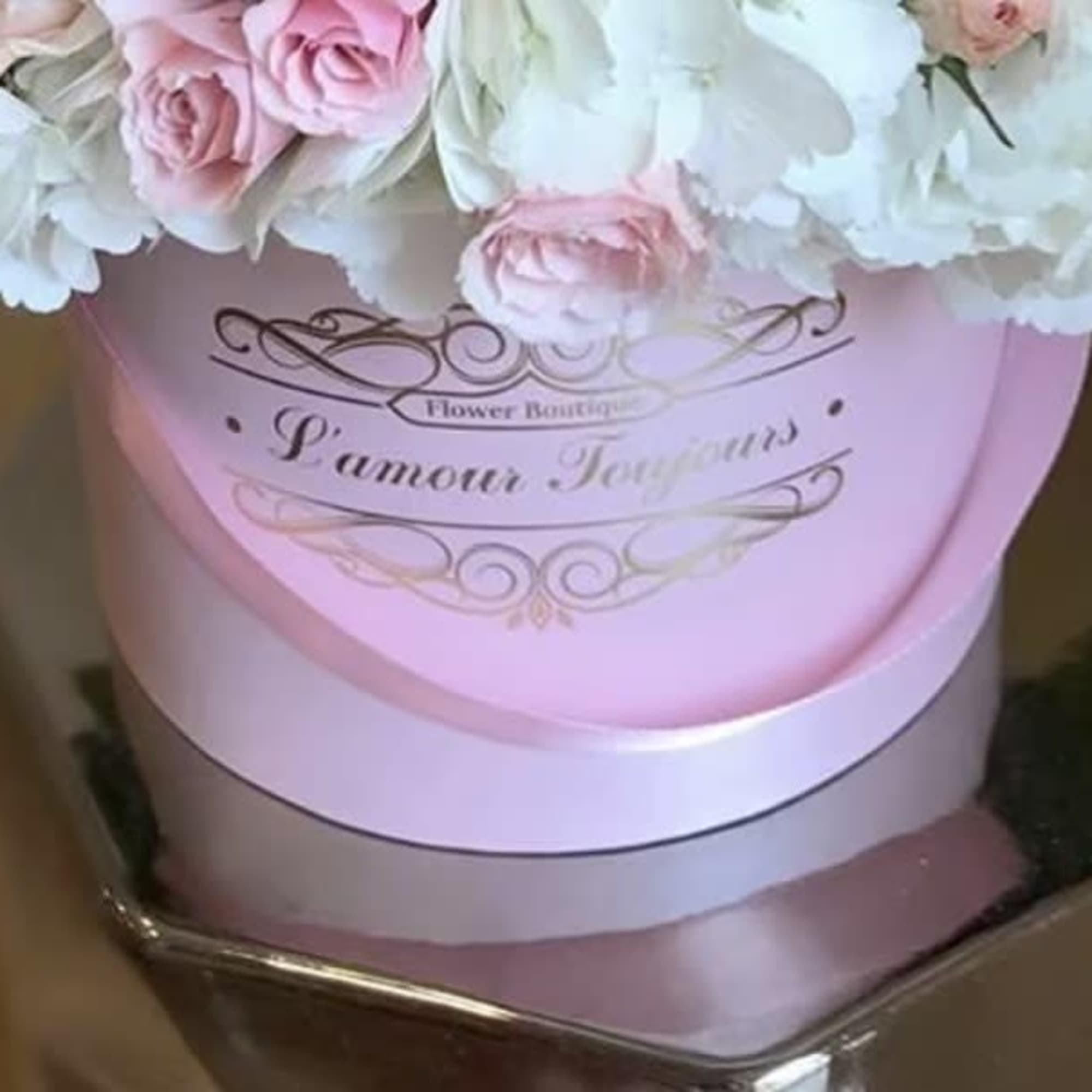 Pink hatbox arrangement of blush roses and white hydrangeas