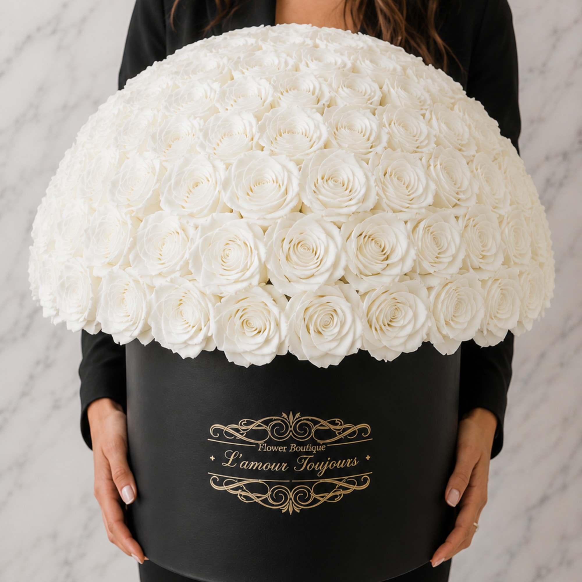 Large white rose arrangement in a black hatbox