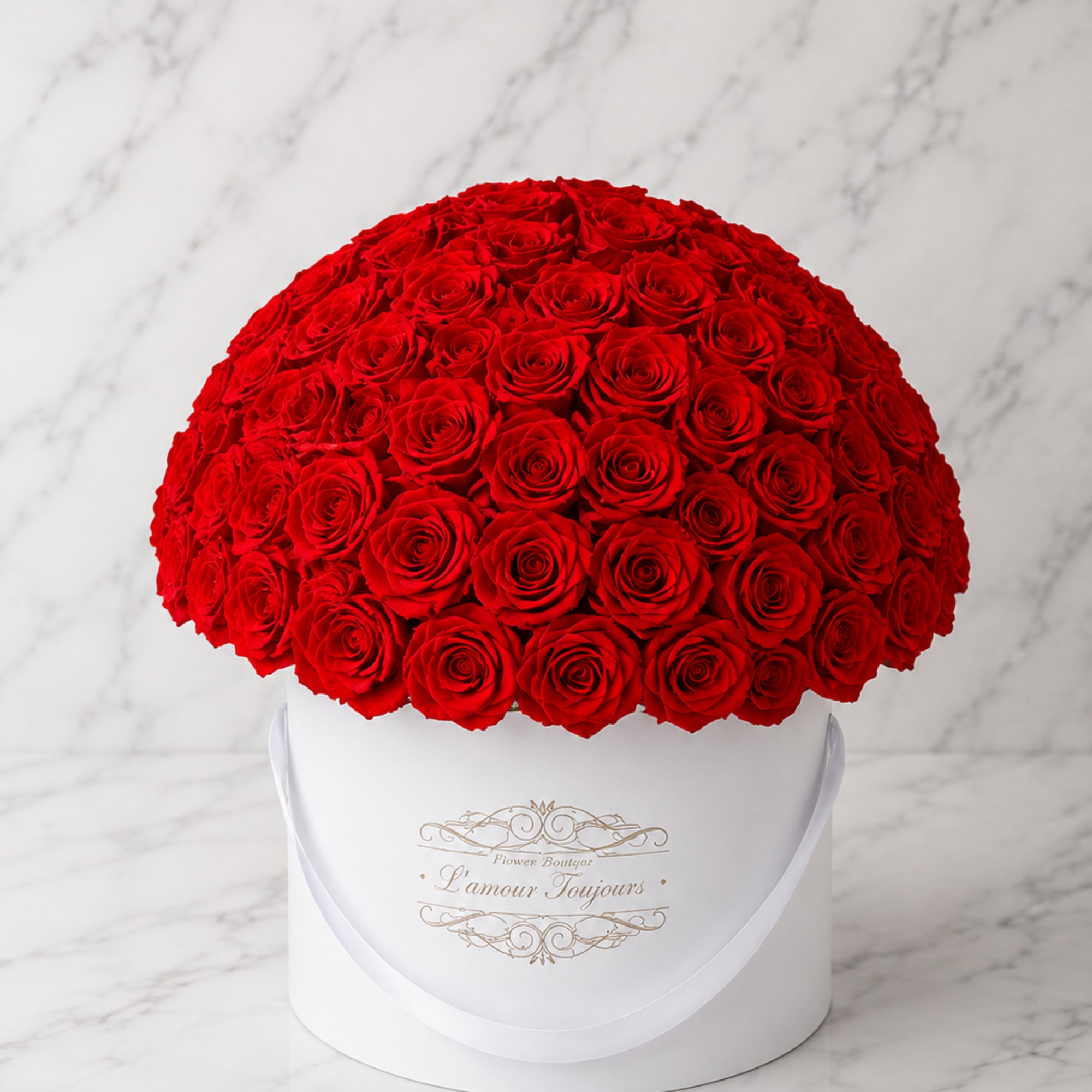 Large dome of red roses in a white round box