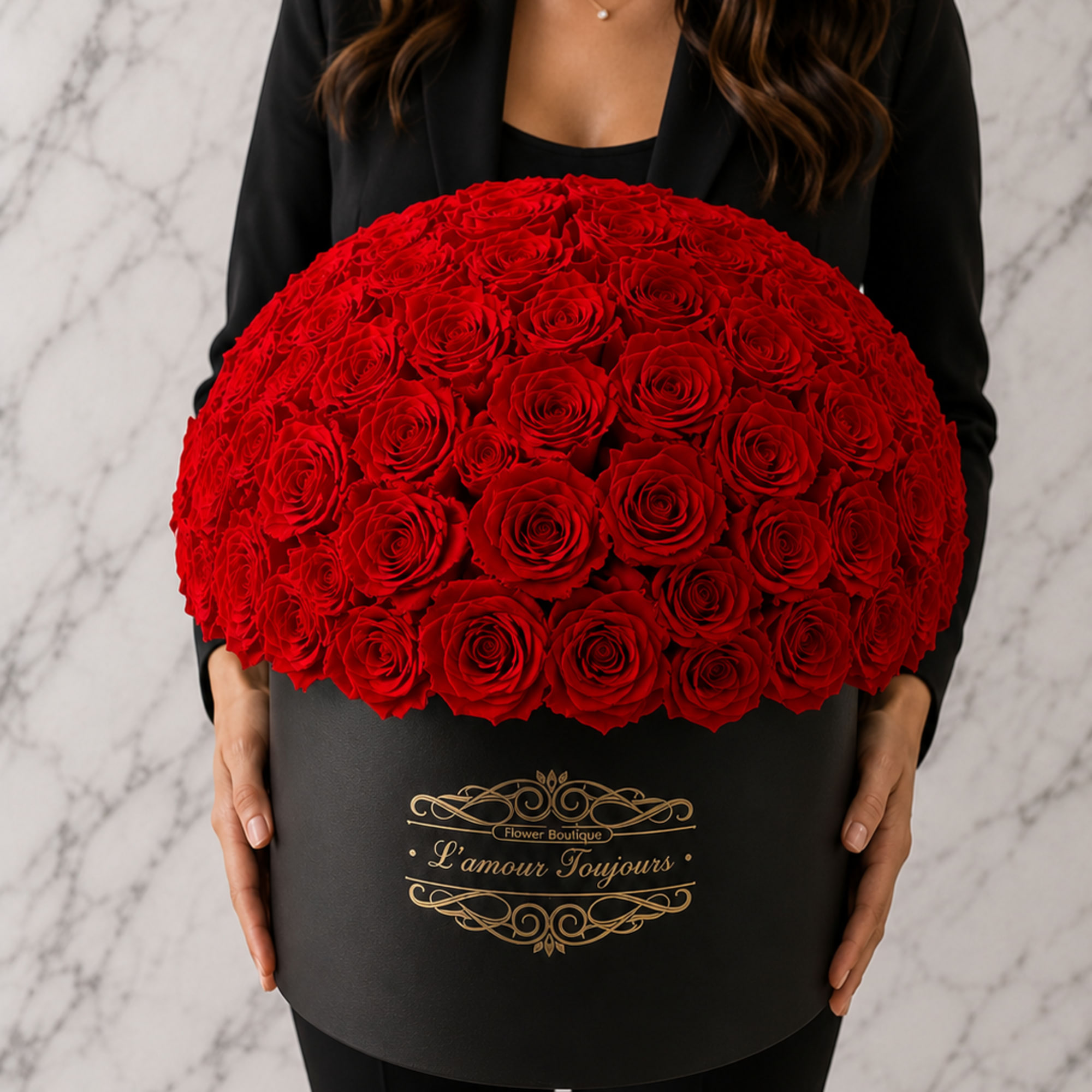 Large dome of red roses in a black hatbox
