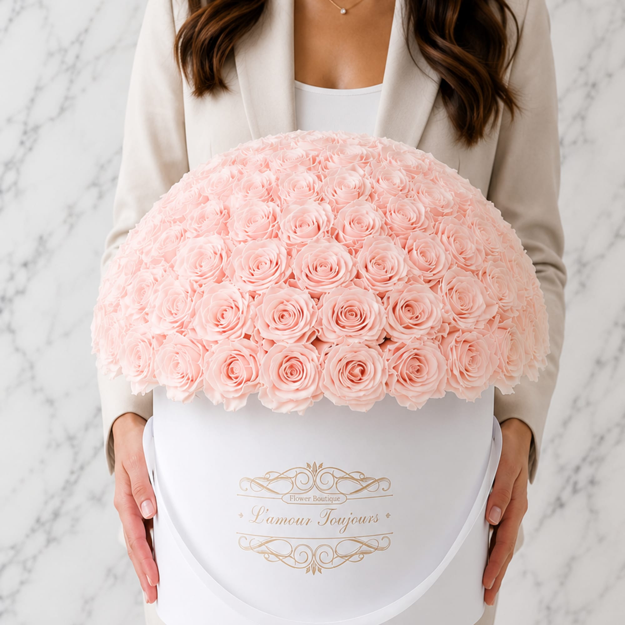 Large dome of pale pink roses in a white hatbox