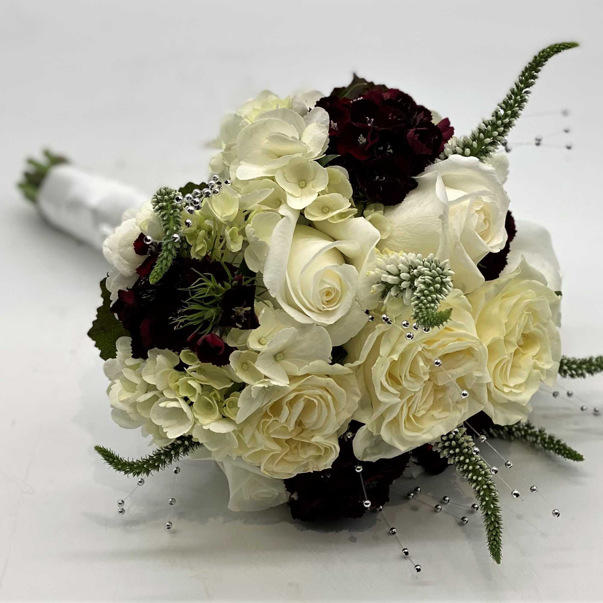 Lush whites, burgundy and pops of silver!