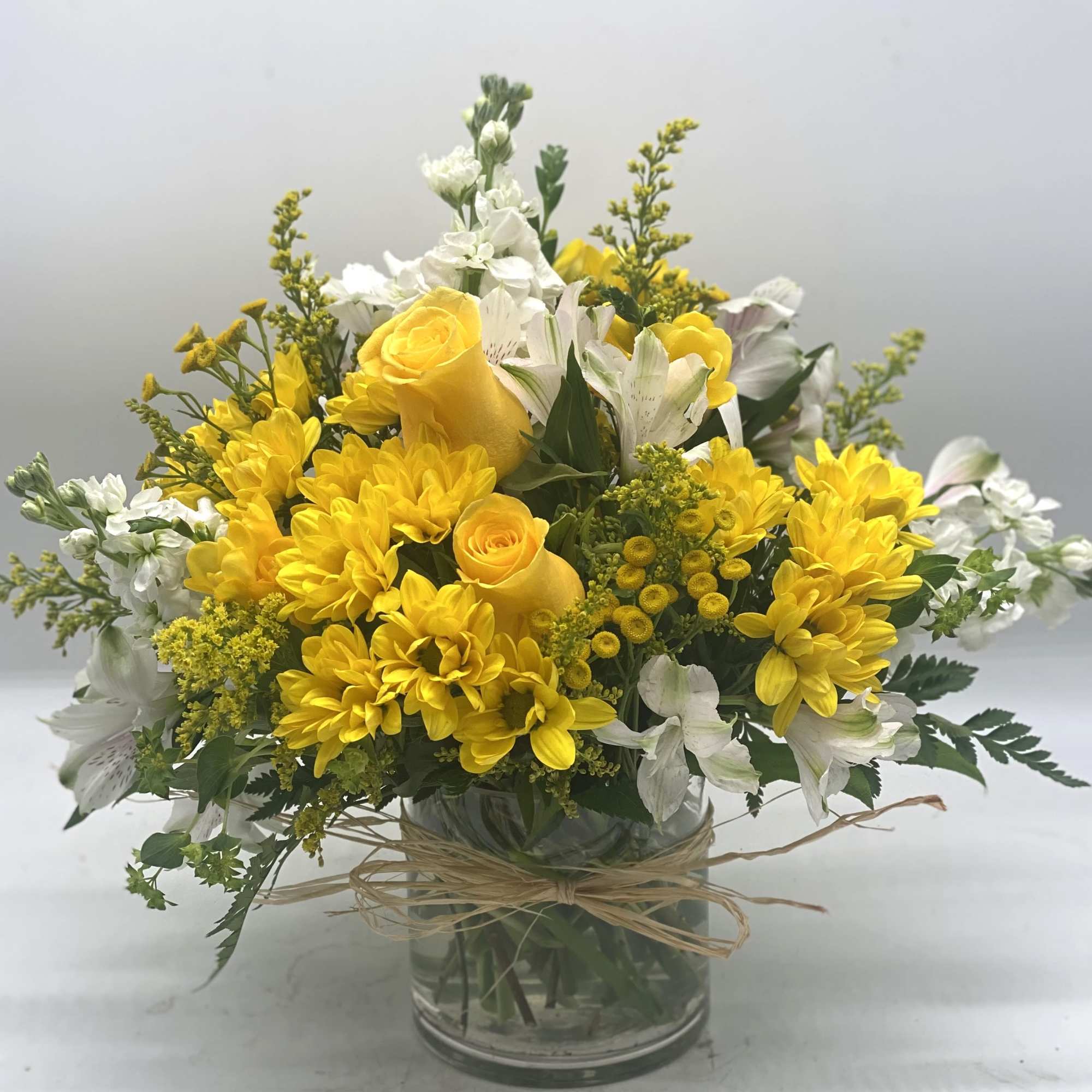 A beautiful and bright mix of yellows and whites designed in a