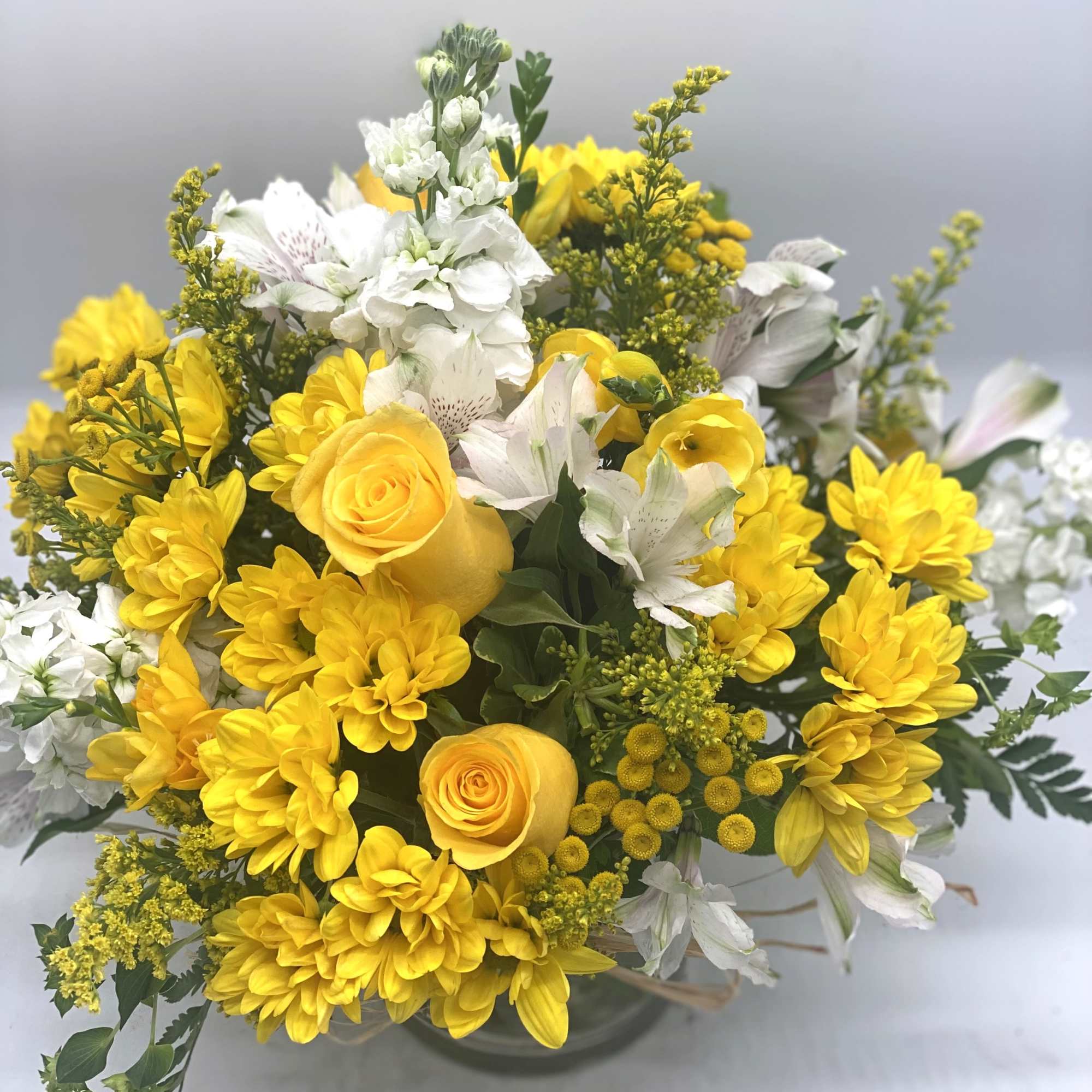A beautiful and bright mix of yellows and whites designed in a, photo 3 of 5