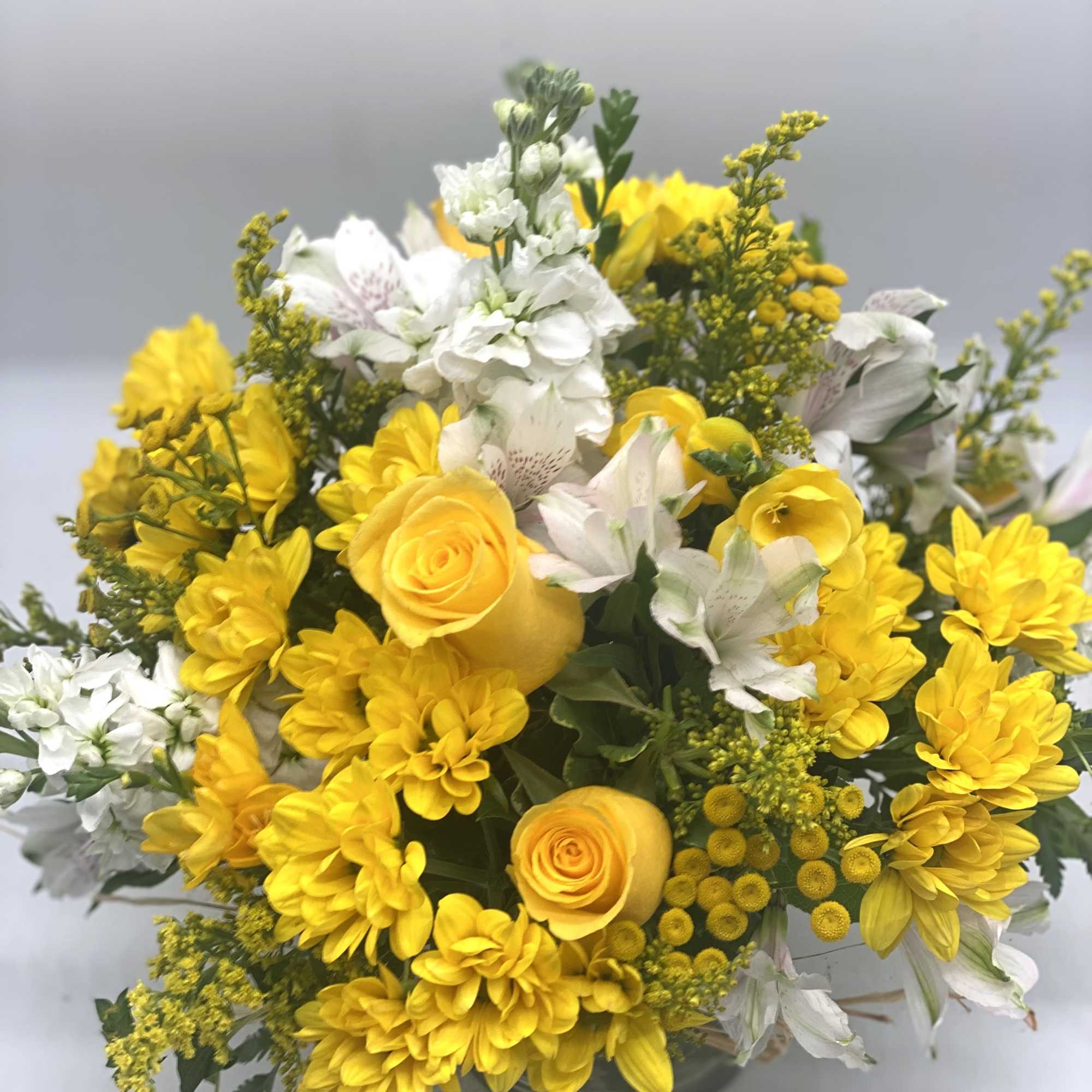 A beautiful and bright mix of yellows and whites designed in a, photo 4 of 5