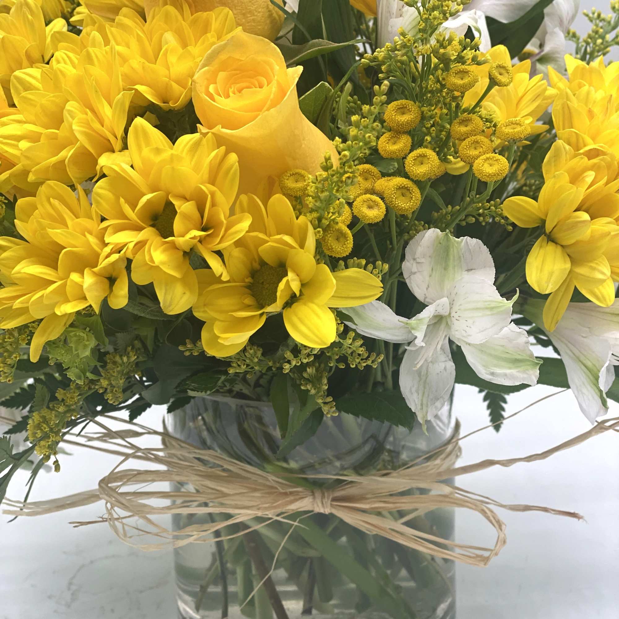 A beautiful and bright mix of yellows and whites designed in a, photo 5 of 5