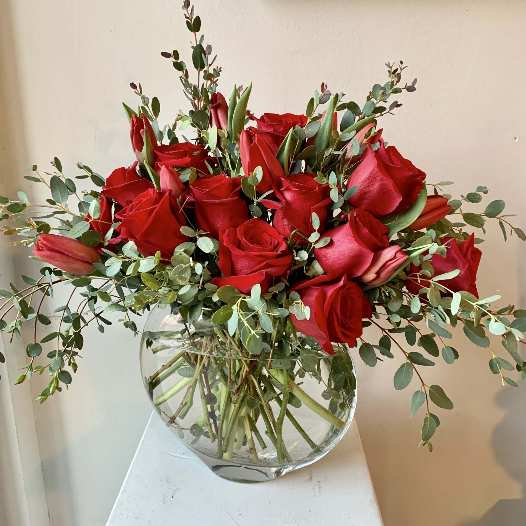 Red Roses and Tulips in a Modern Glass Vase